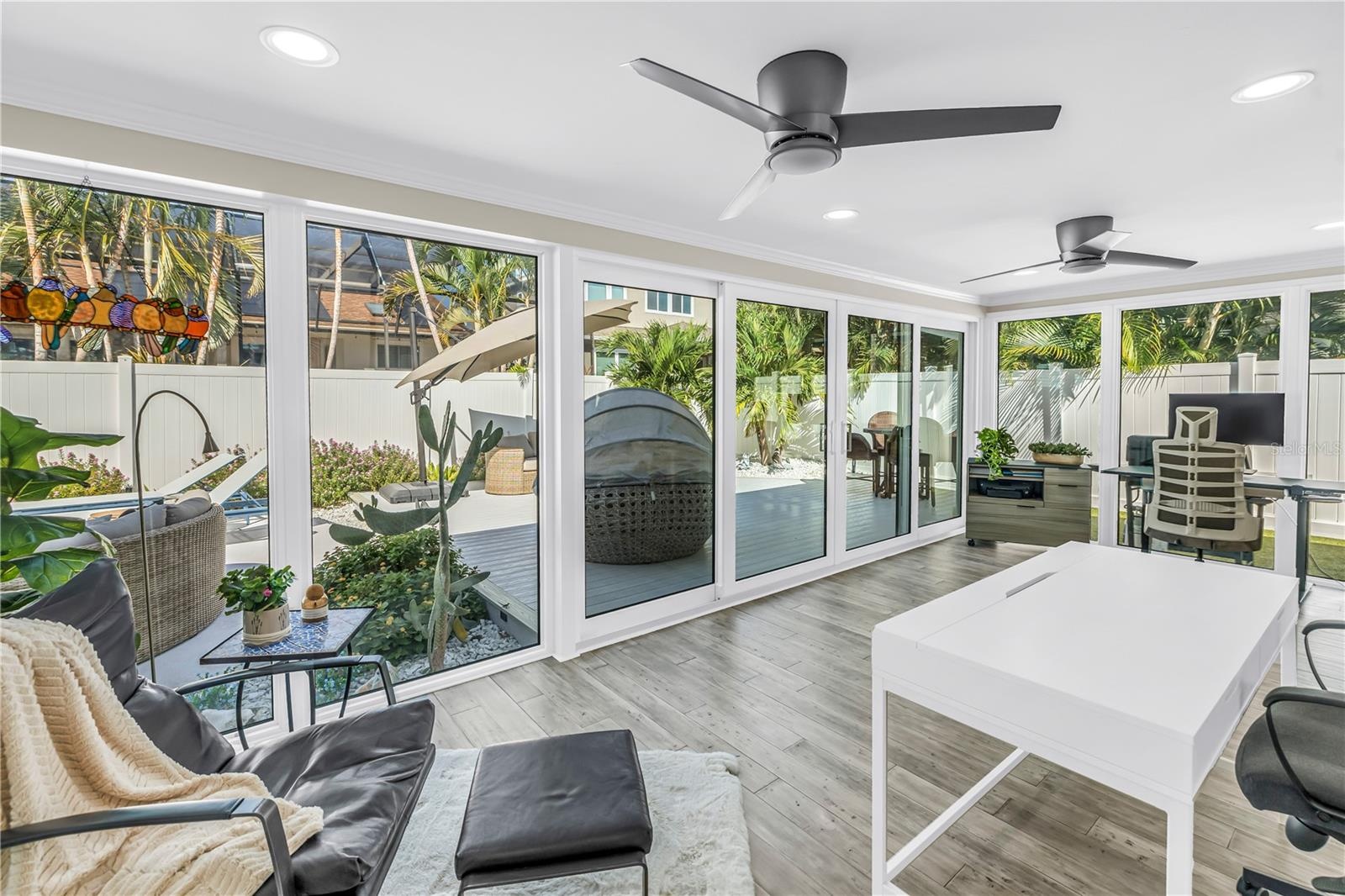 Beautiful light filled living space surrounded by impact rated double sliders.