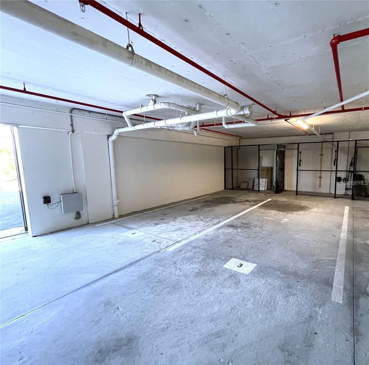 2 Parking Spots in Garage with Storage Rooms