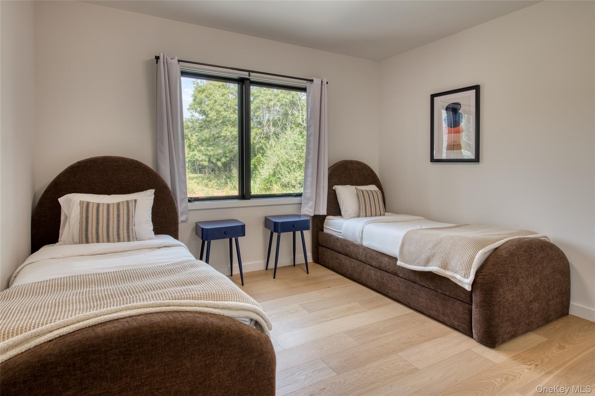 Light wood-finish flooring with a neutral wall color