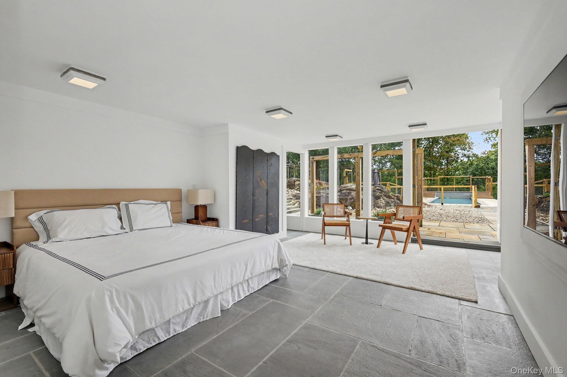 Guest bedroom 1 with walk out to patio