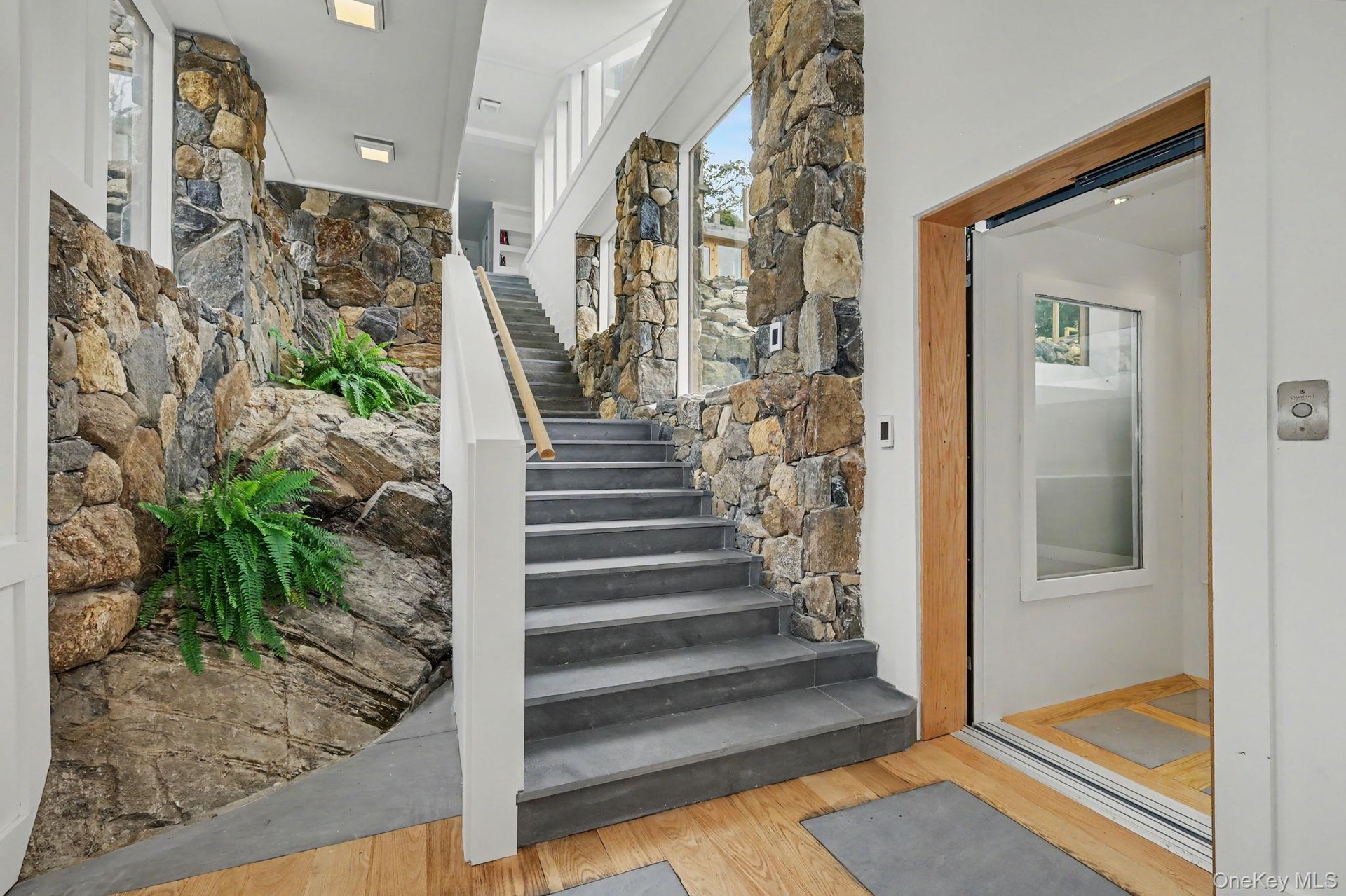 Hall to 2nd floor and glass elevator