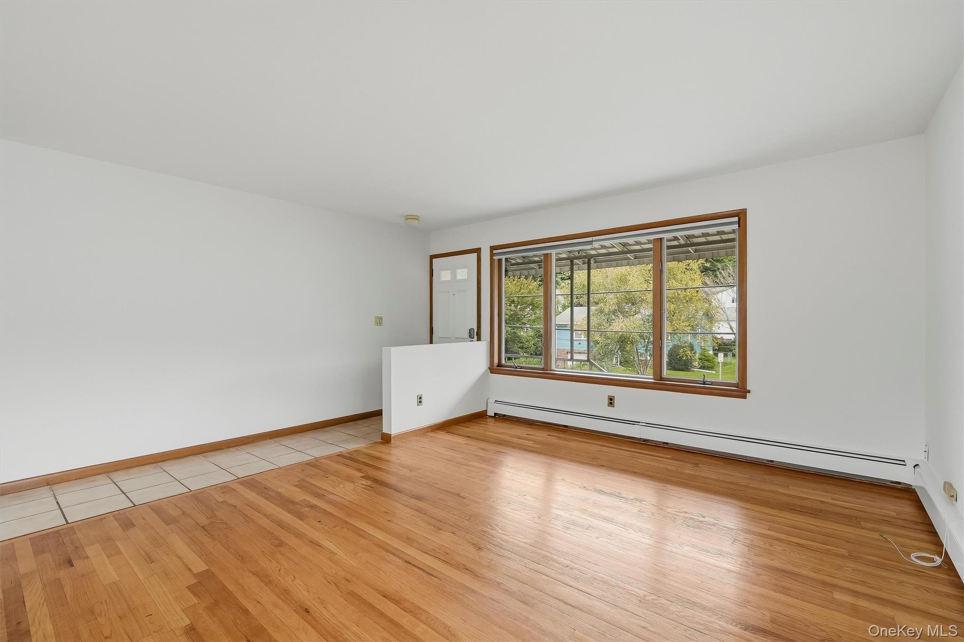 Entry with view towards Living Room, Dining Area, Kitchen.  Unit 1