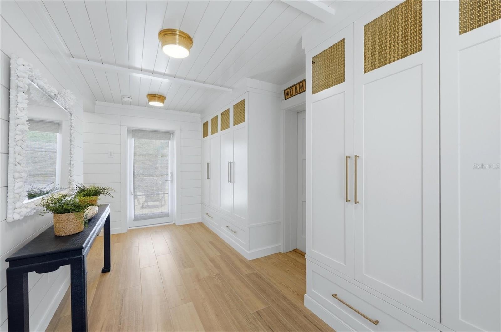 Beautifully designed front entry with custom designed cabinetry