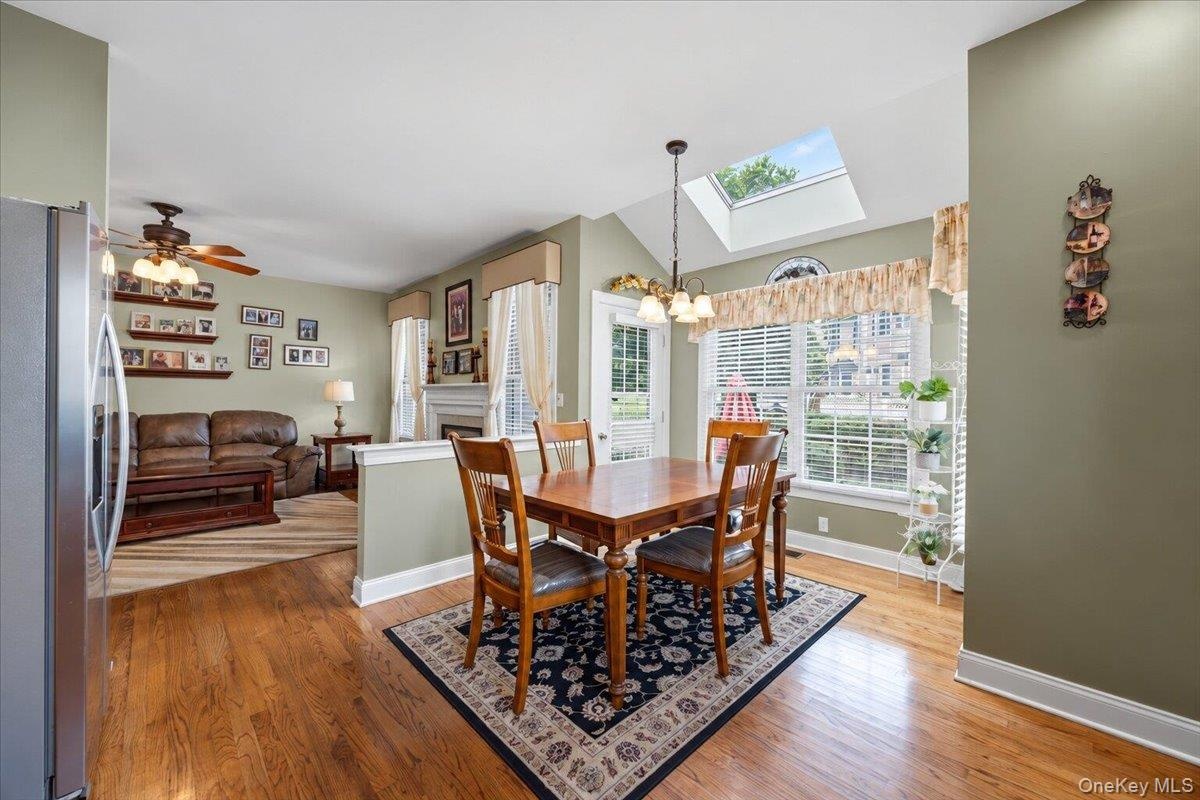 Kitchen Features Skylight and Door to Back Patio