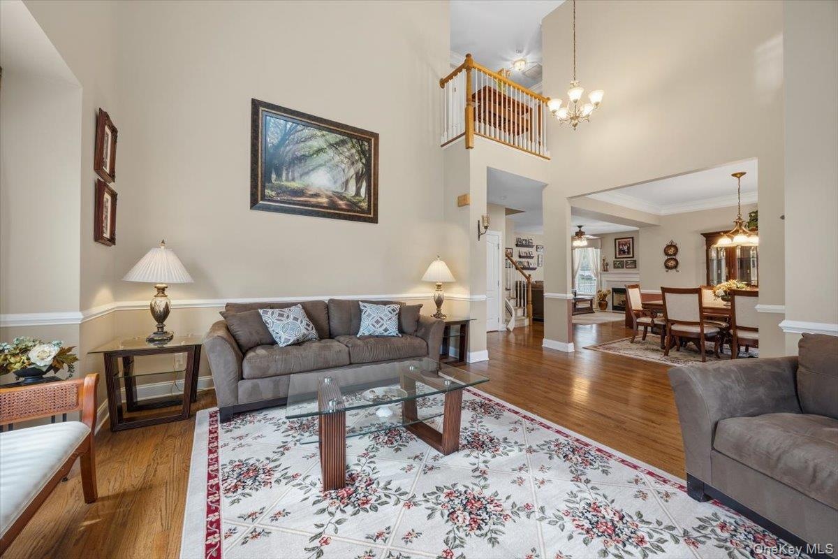 Open Concept Living Space Featuring Cathedral Ceiling with Second Level Overlook