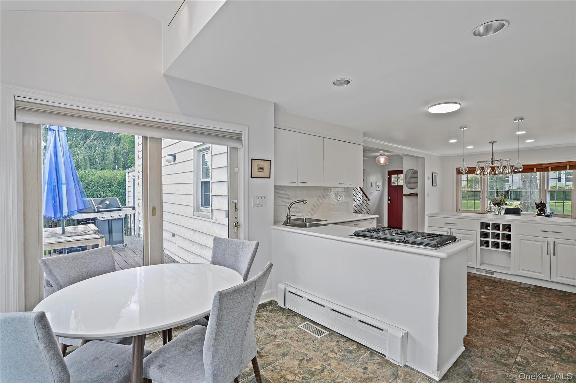 Breakfast Area With Sliding Glass Door To Spacious Deck