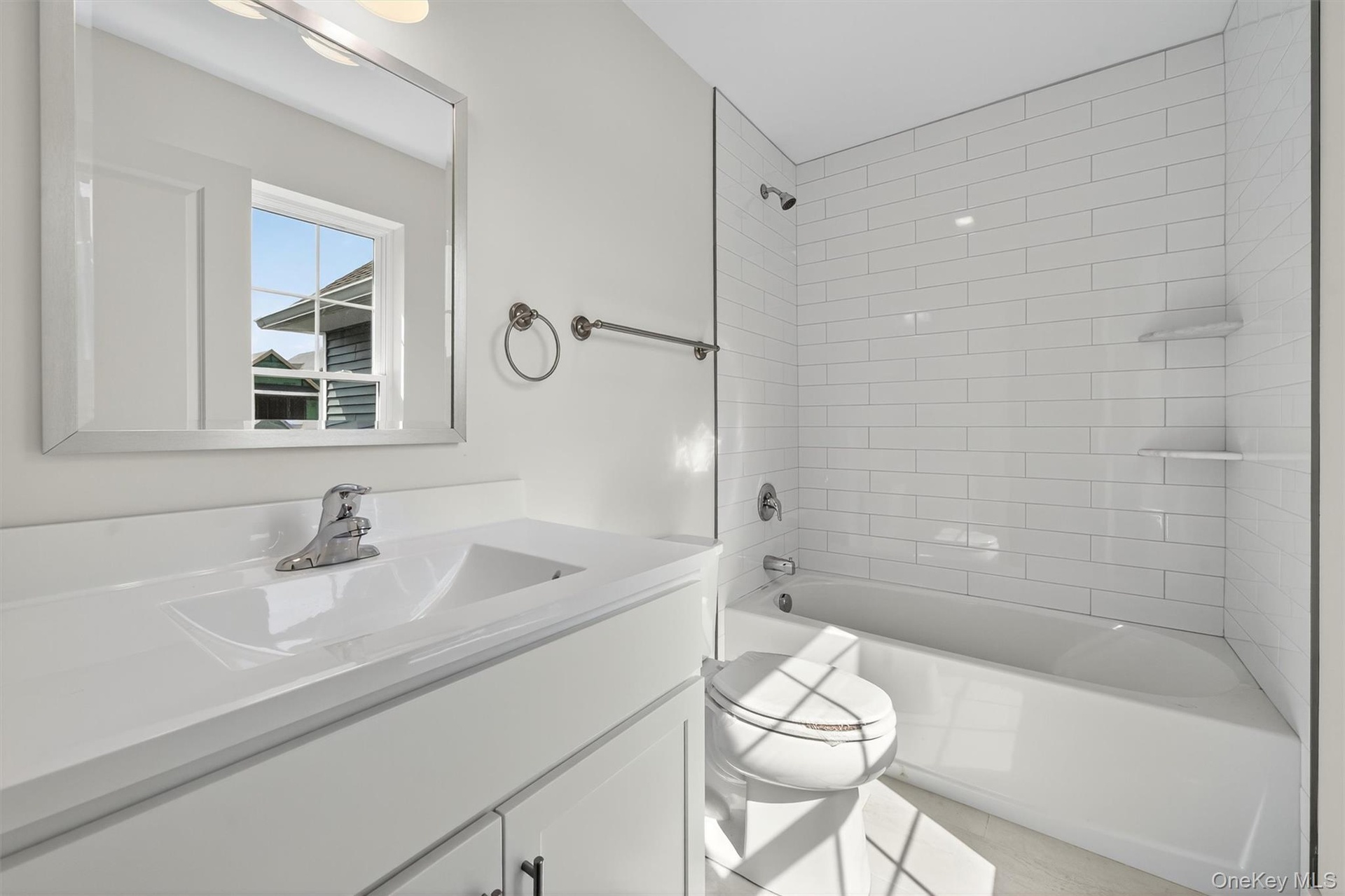 Full bathroom featuring shower / bath combination and vanity