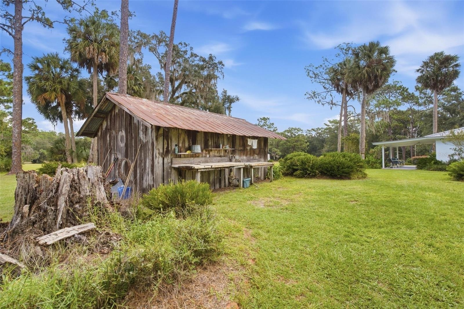 100 Year Old Cypress Constructed Carport with outdoor cleaning station
