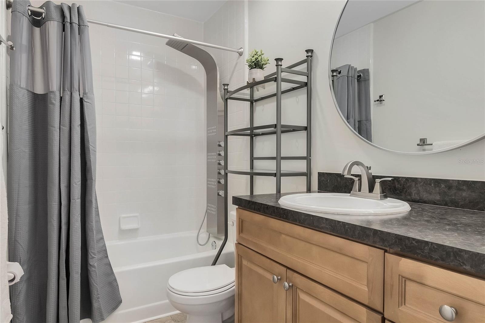Secondary bathroom upstairs with updated shower head