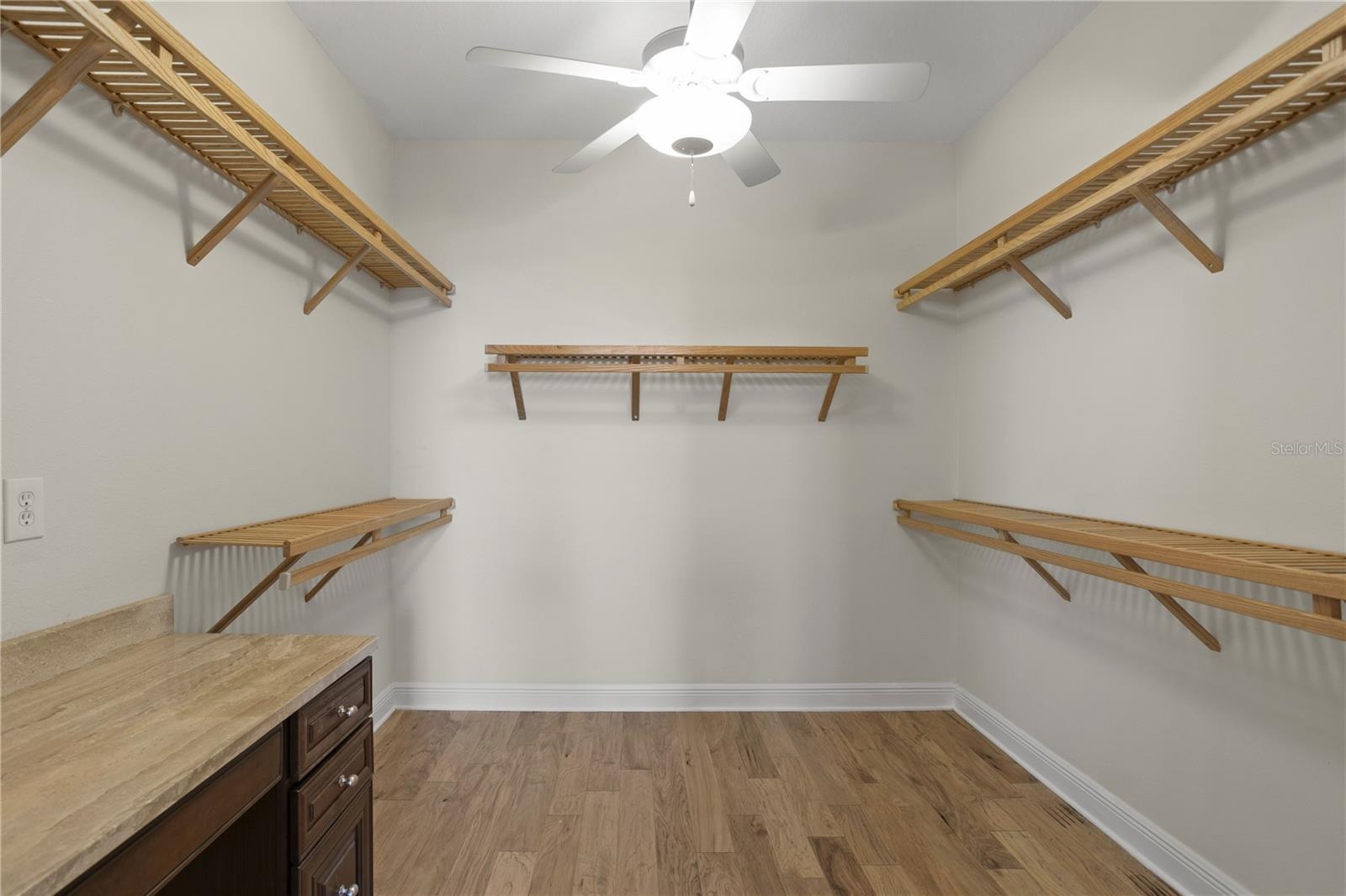 HUGE walk-in closet with built in vanity off of the Primary Bathroom