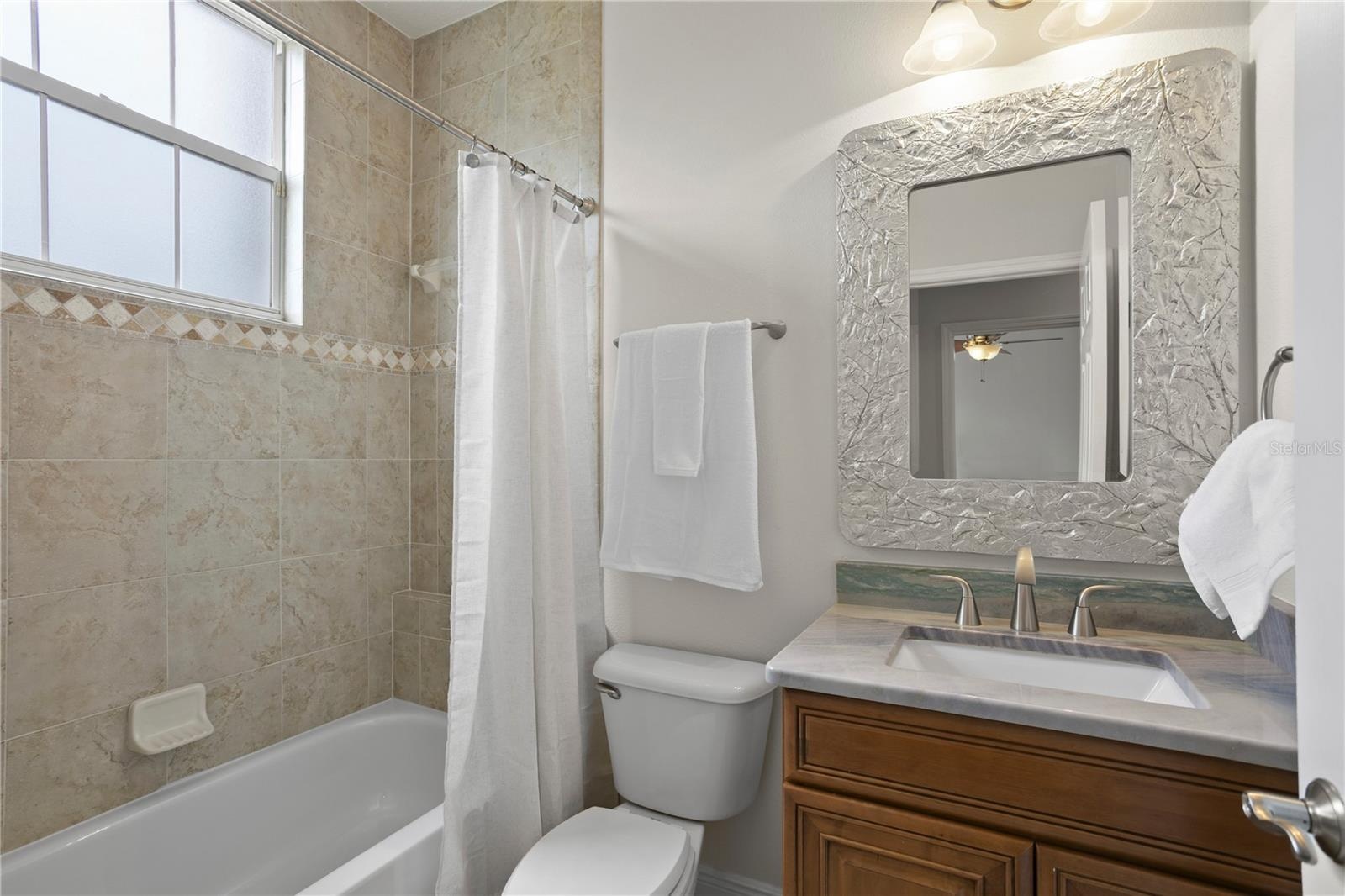 Full bathroom on main floor, right off of the bedroom