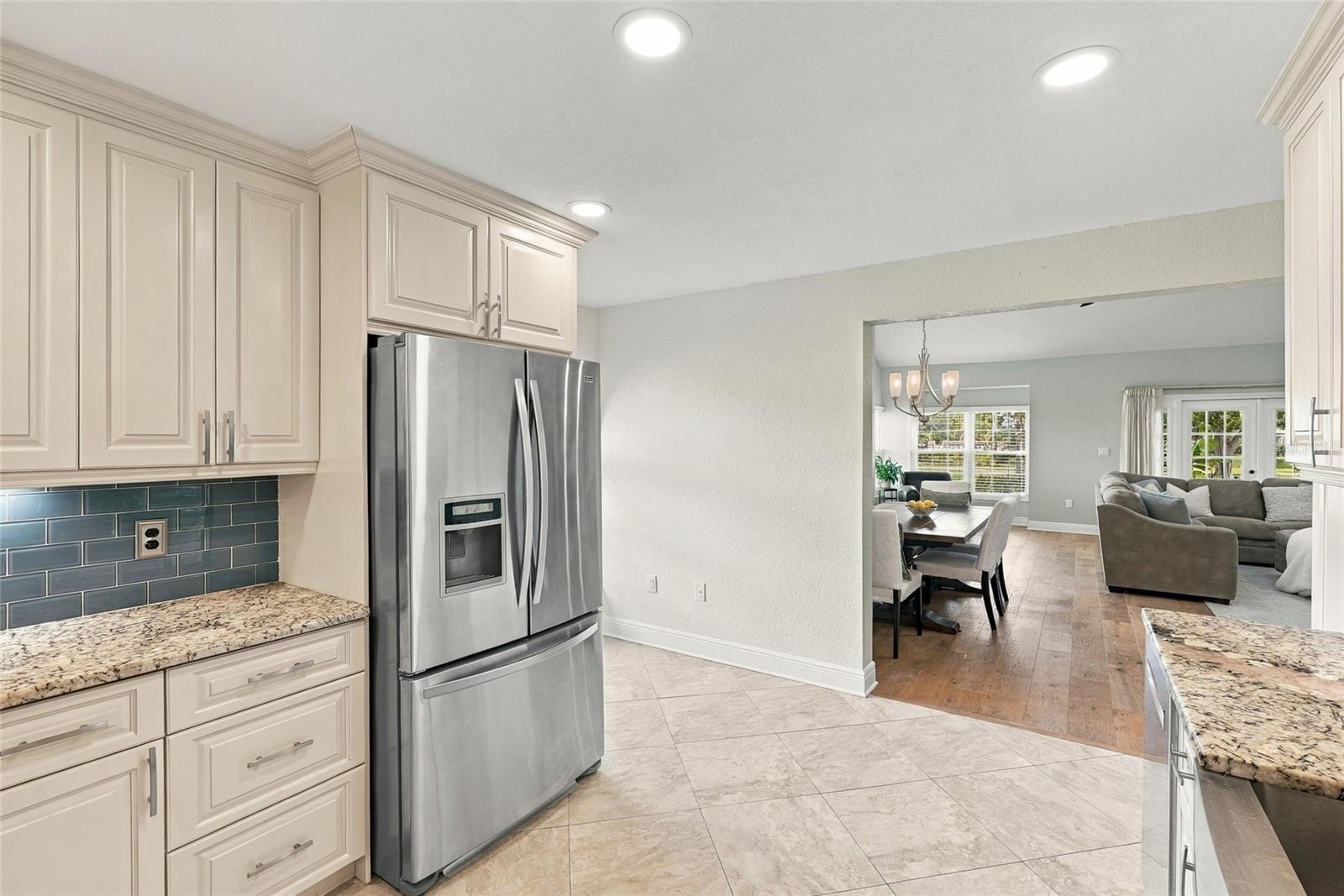 A GE Profile five-burner range with dual ovens makes this kitchen equally suited for everyday meals and entertaining.