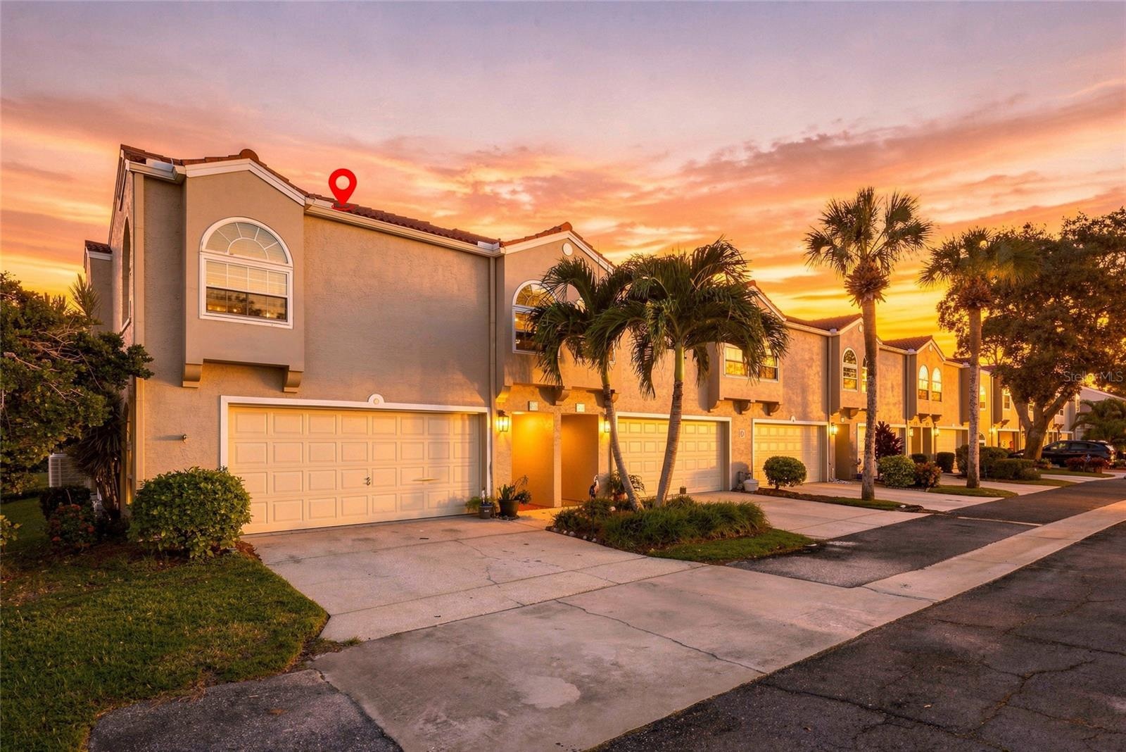Beautiful twilight view showcasing the home’s desirable corner setting and inviting exterior.