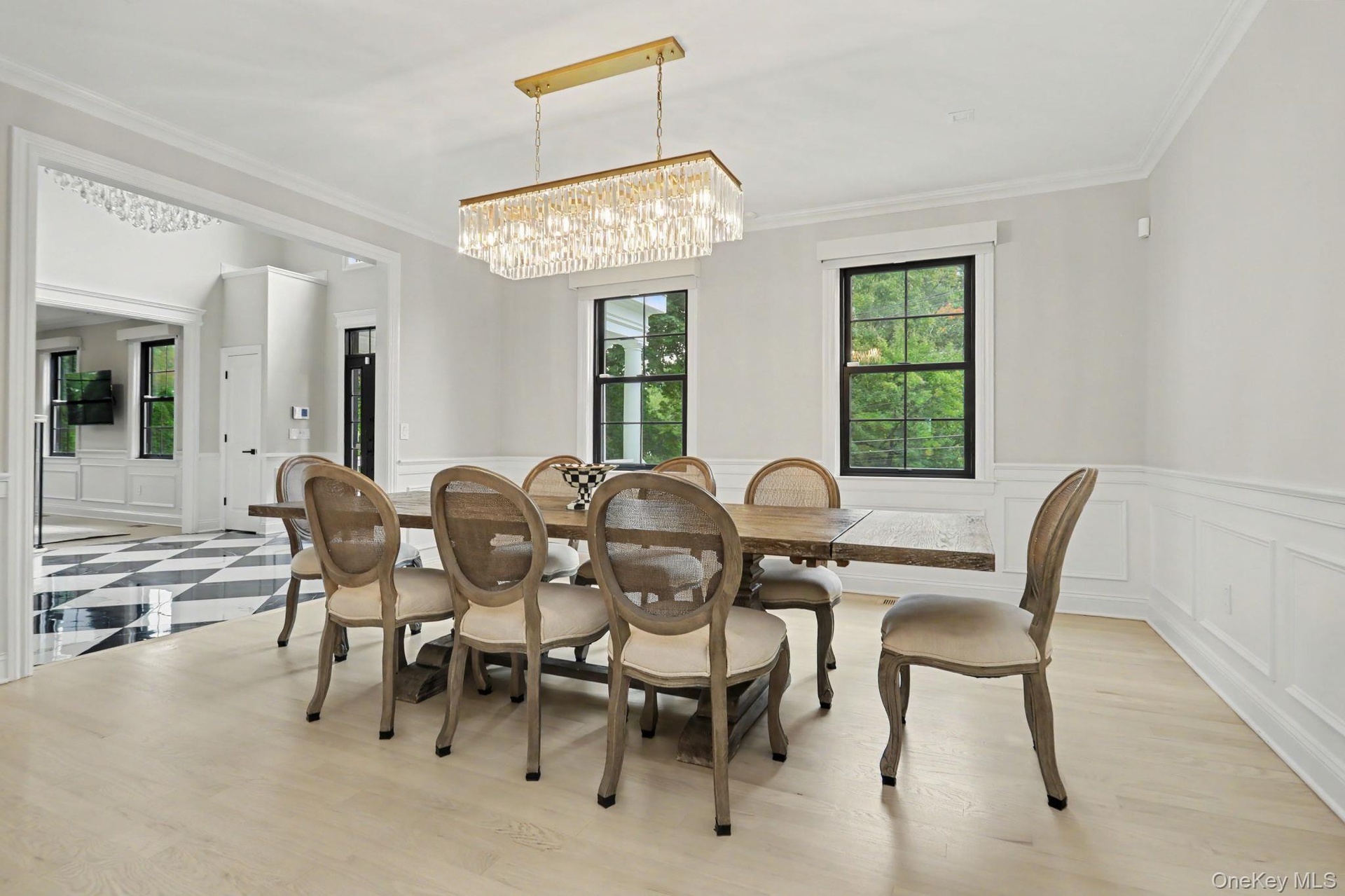 Dining room with beautiful light fixture.