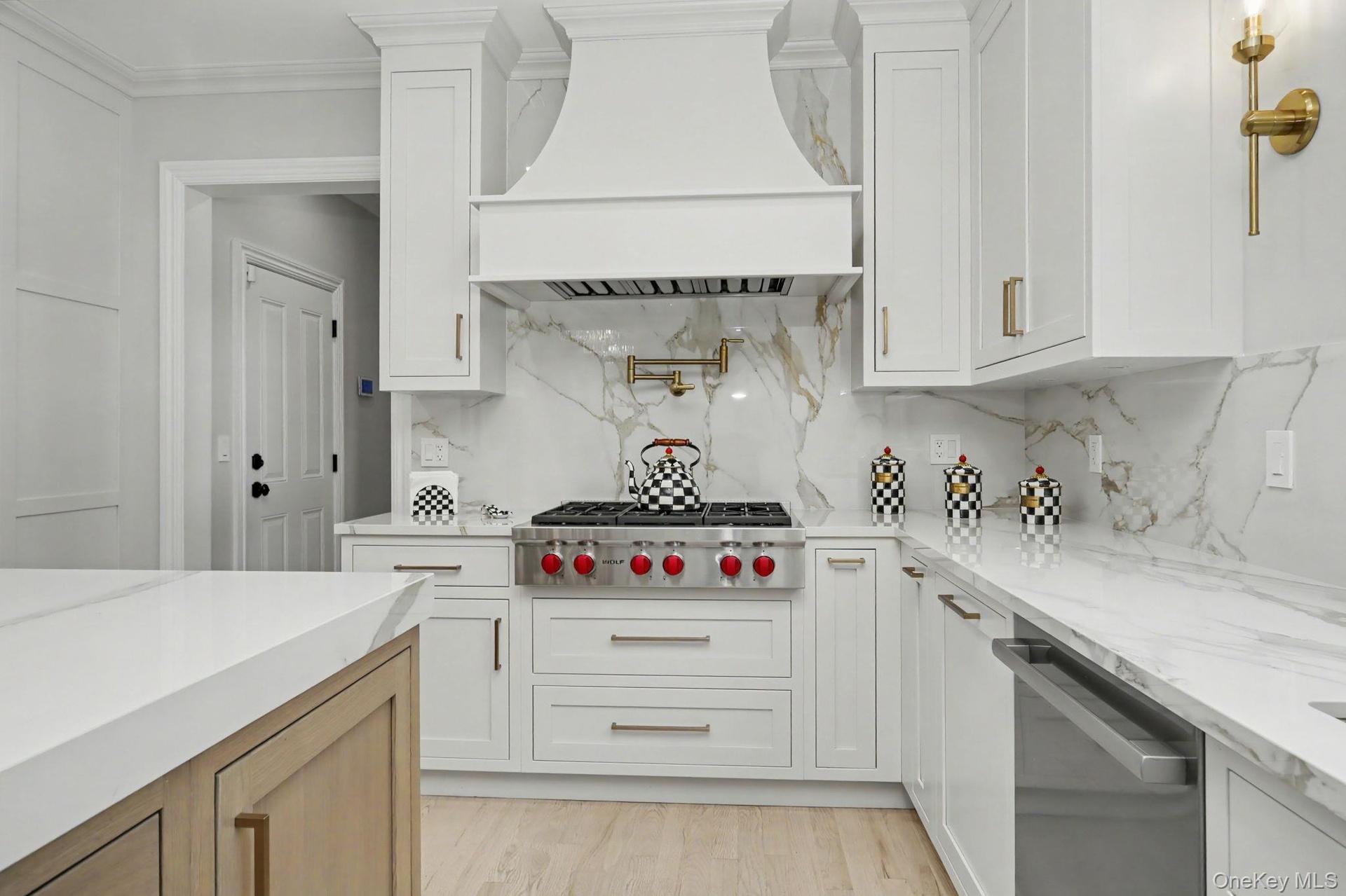 Custom design kitchen with Island and Sub-zero Refrigerator and Wolf appliances.