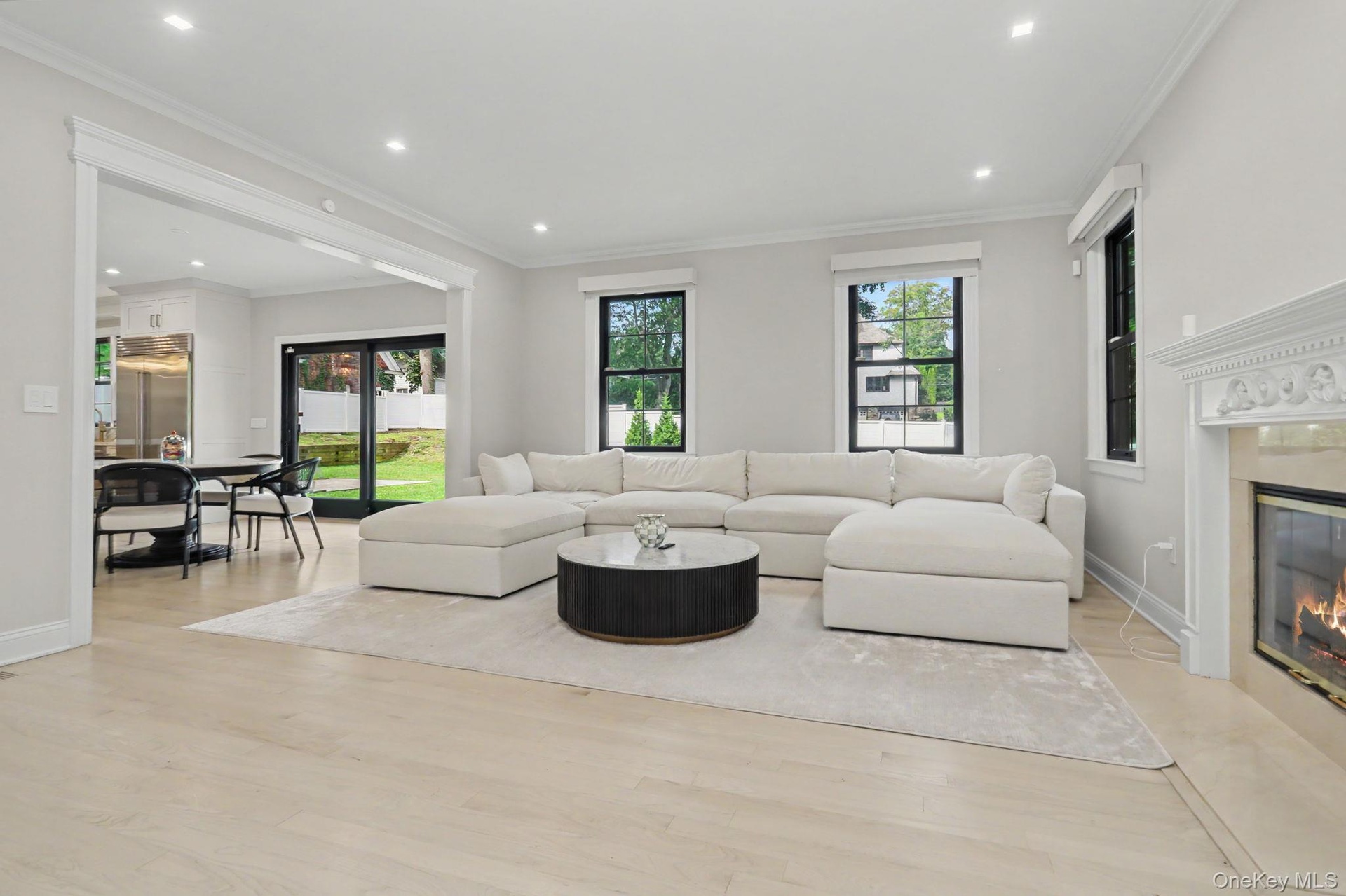 Family room with fireplace, Custom shades.