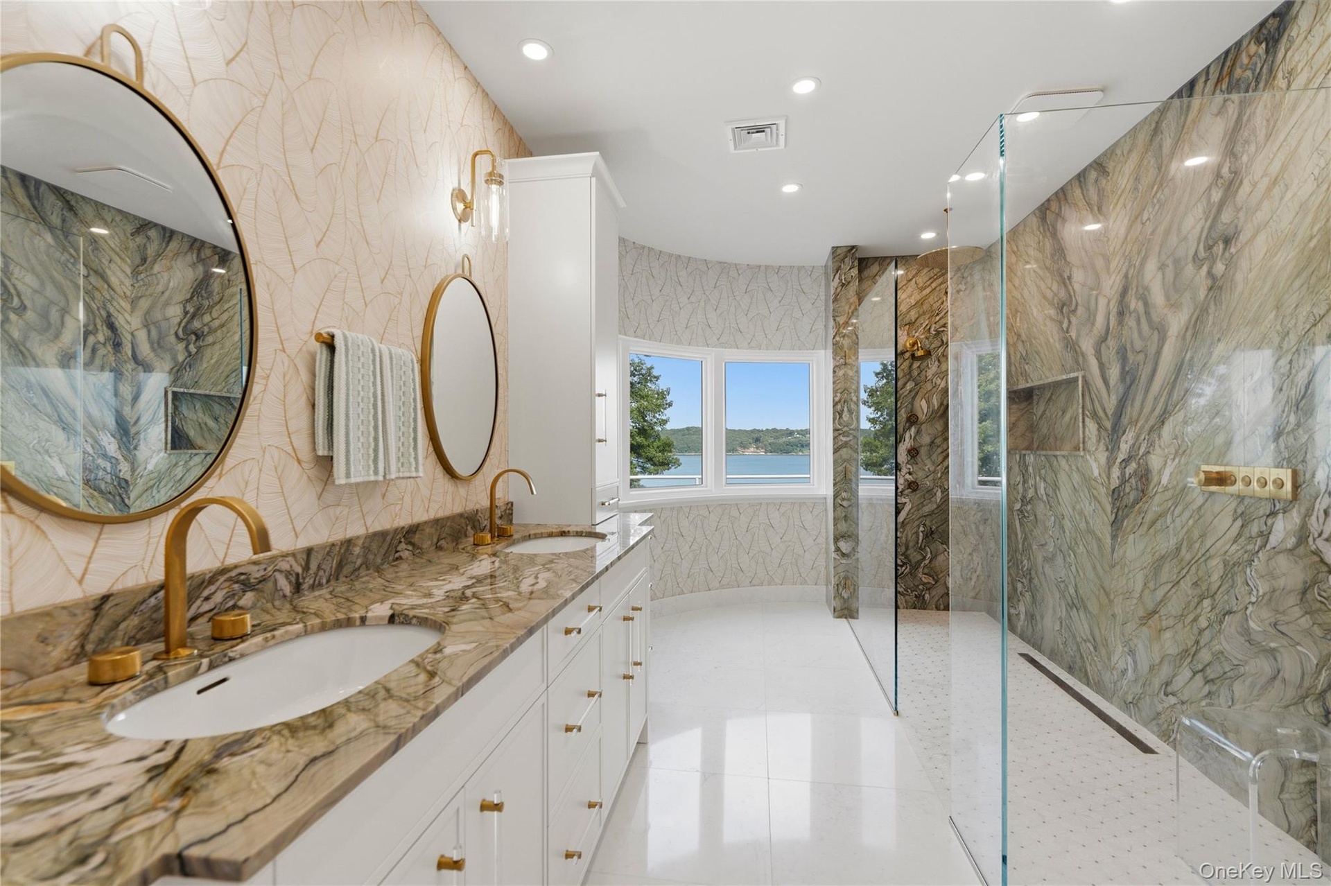 Primary designer marble bath with dual vanities