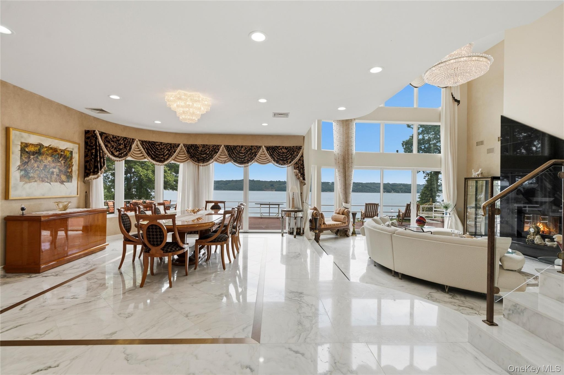 Great room with Marble floors, brass inlay, fireplace