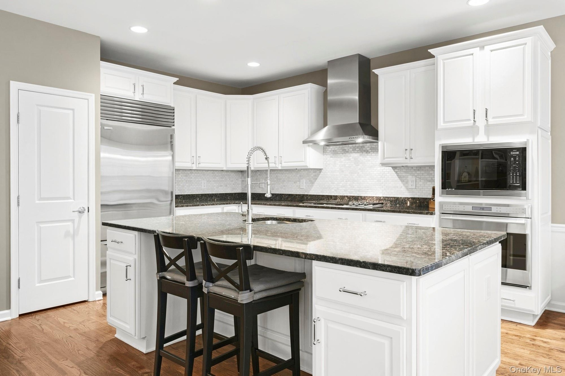 Beautiful kitchen with Granite Countertops and top of the line appliances. Wolf, Sub-Zero and Fisher Paykel