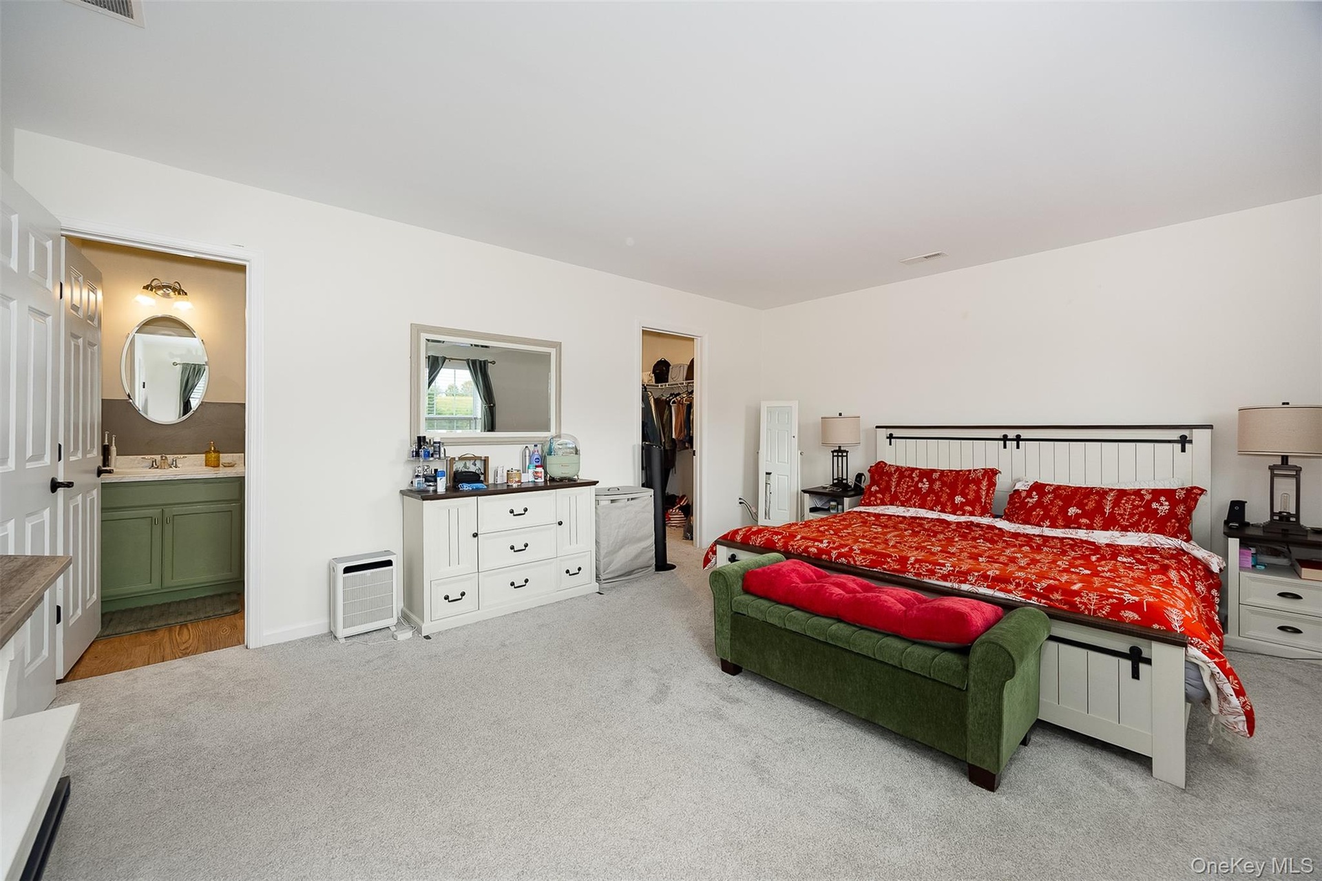 White paneled bed frame with dark hardware