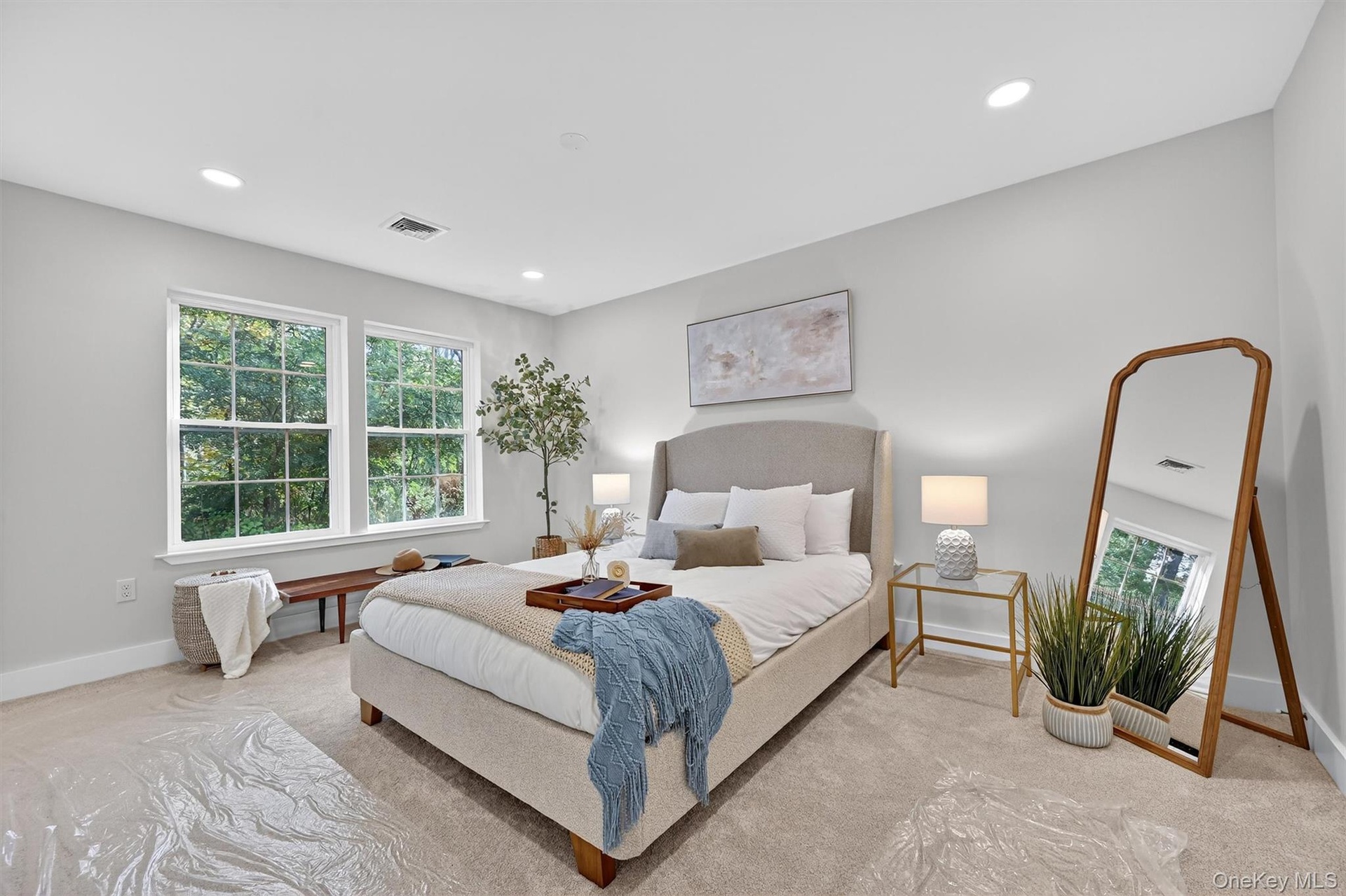 Bedroom with multiple windows, carpet floors, and recessed lighting