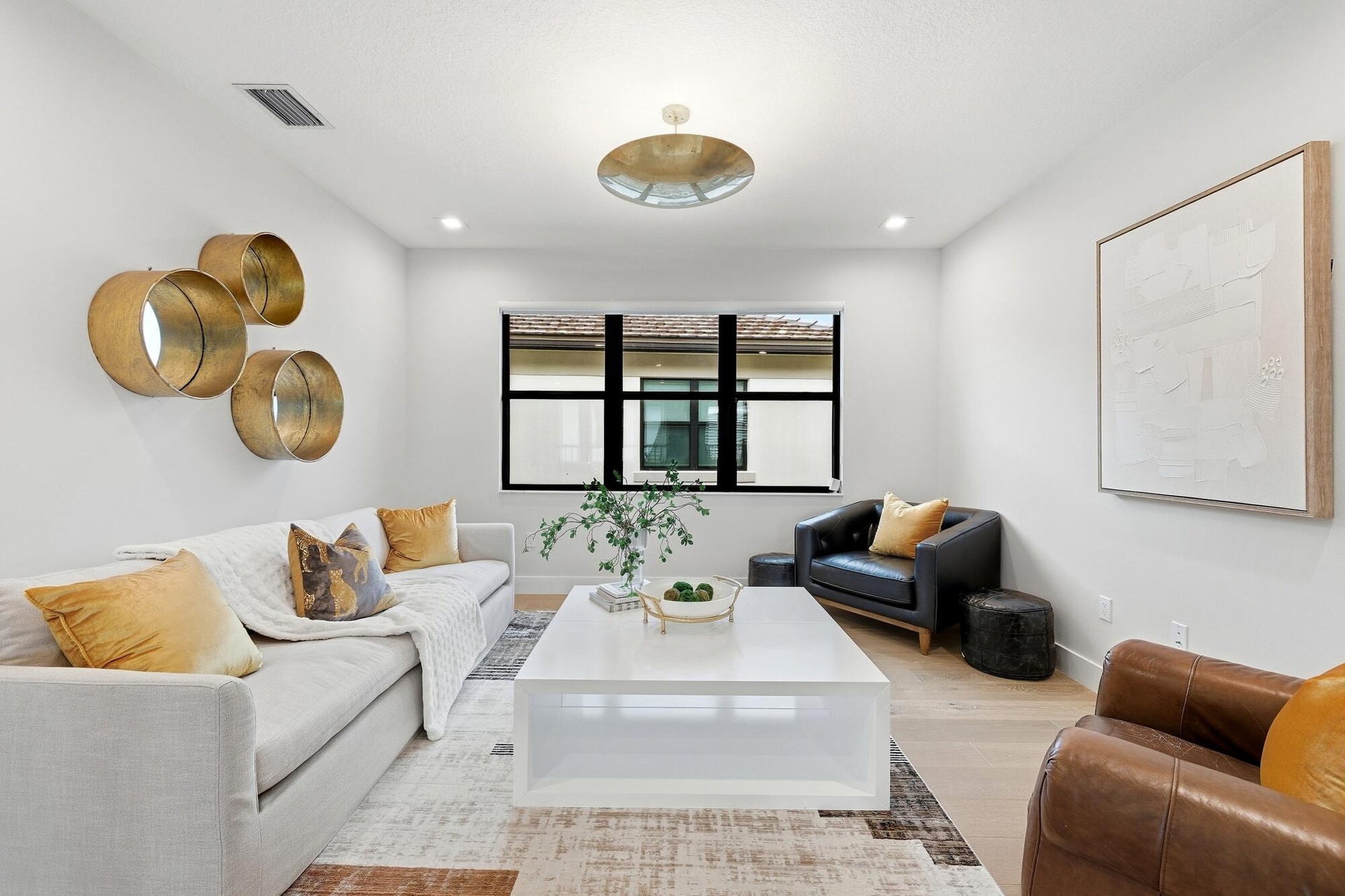 Recessed lighting, wood-finish flooring, and a contemporary ceiling fixture