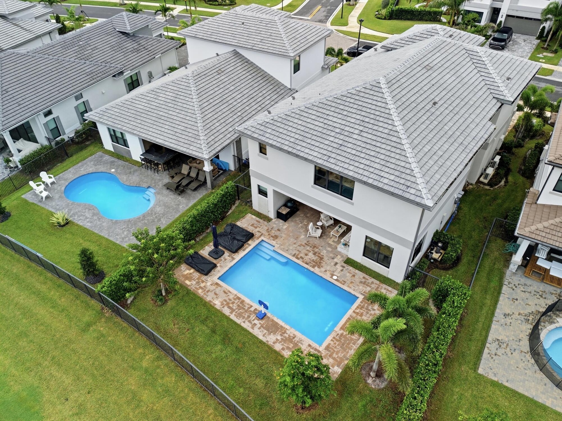 Two-story residence featuring a private pool and extended patio