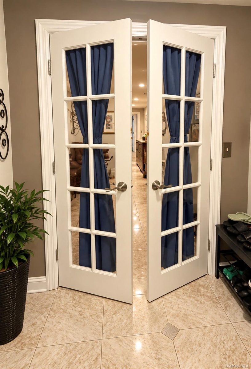 French doors with glass panels and brushed nickel hardware