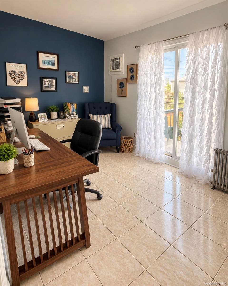 Expansive room featuring a two-tone paint scheme, large sliding glass doors, window-mounted air conditioning unit, and tiled flooring