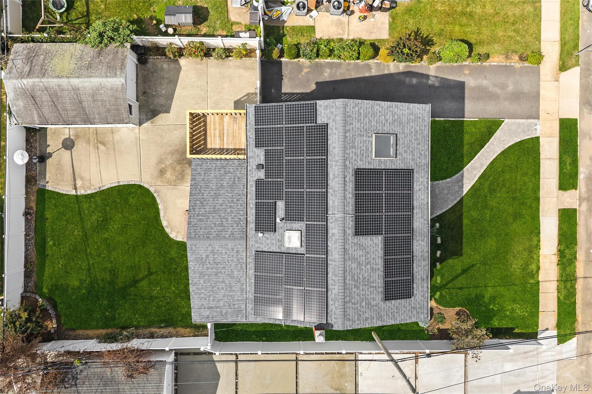 Roofline featuring multiple solar panel arrays and a skylight