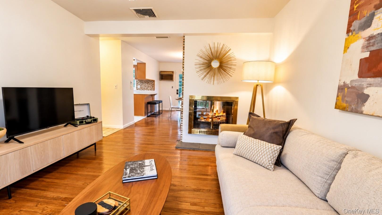Another beautiful view of the spacious family room, showcasing its seamless flow into the inviting eat-in kitchen—an ideal layout for everyday living 