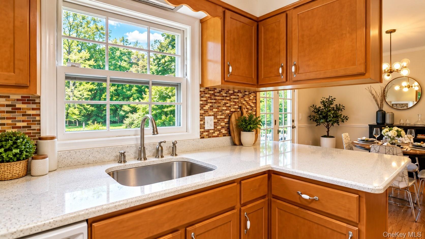 Enjoy abundant countertop space, plenty of natural light, and beautiful views overlooking your spectacular backyard oasis—perfect for cooking, gatheri