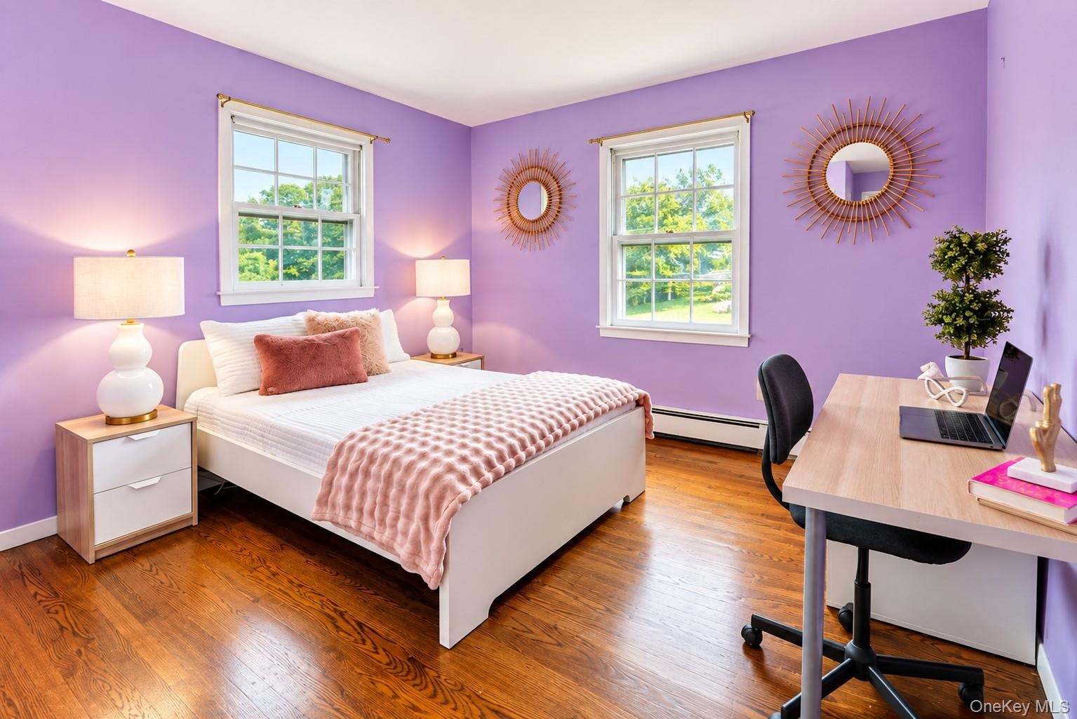 Secondary bedroom with abundance of natural lighting.