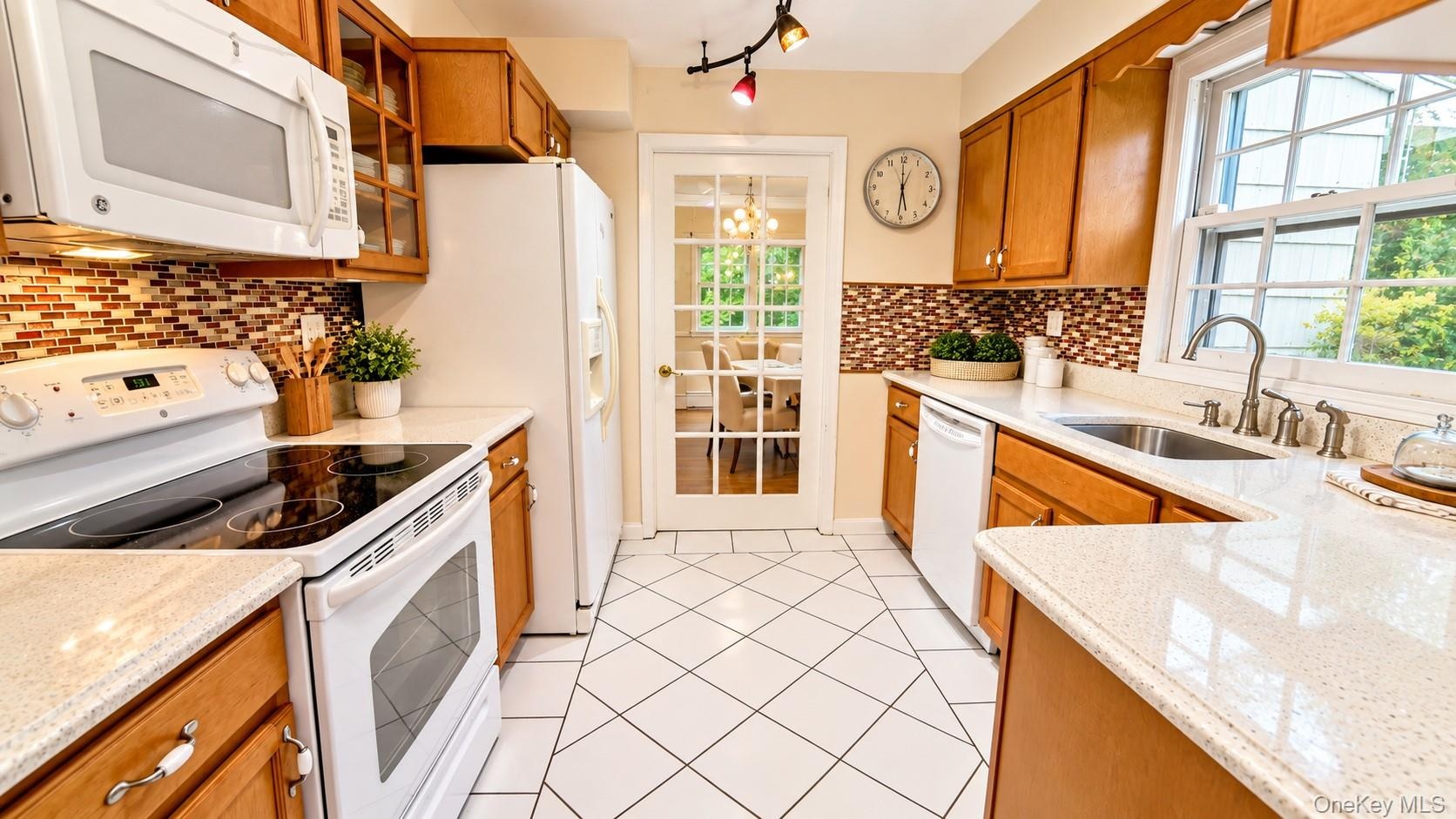 The kitchen features easy access to the formal dining area and eat-in-kitchen.