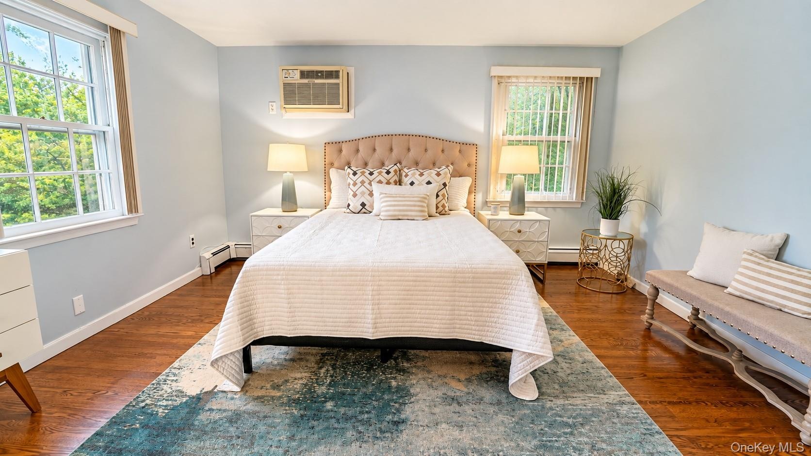 Another beautiful view of the spacious primary bedroom, showcasing its generous proportions and comfortable, inviting atmosphere—perfect for relaxing 