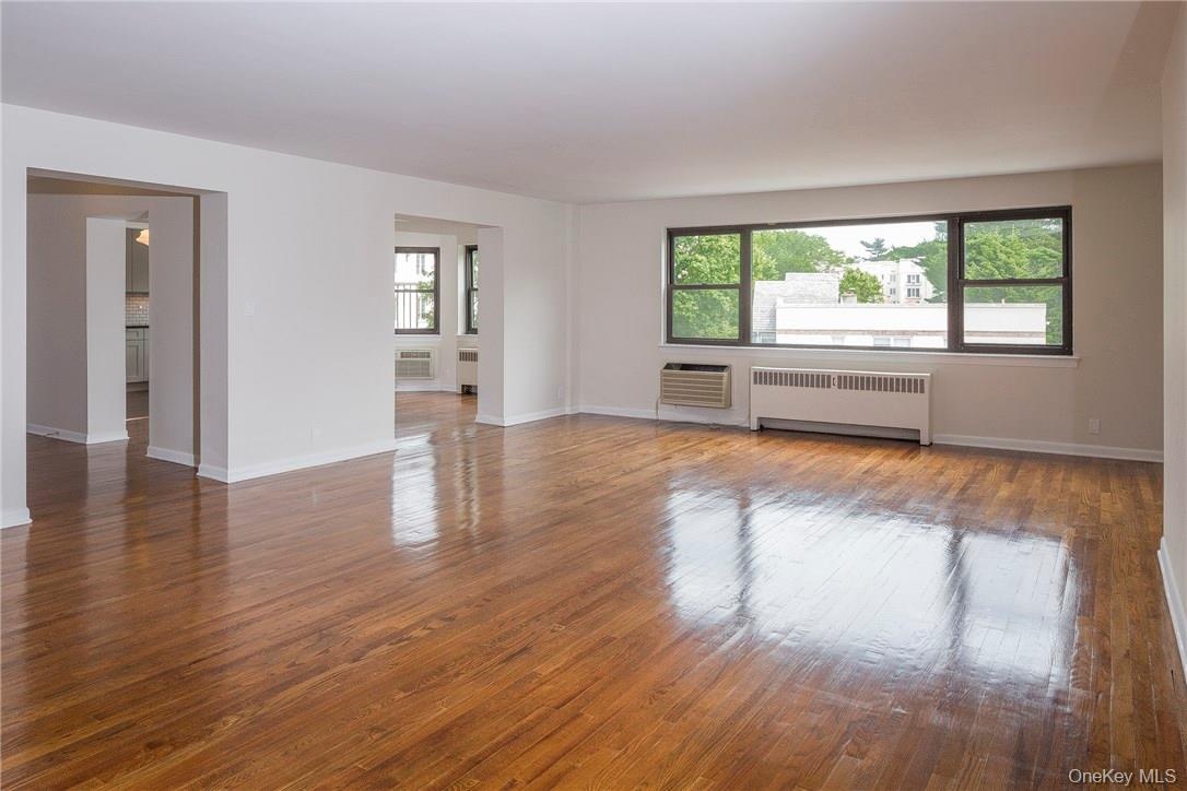 Huge living room opens to dining room and entry way to apartment