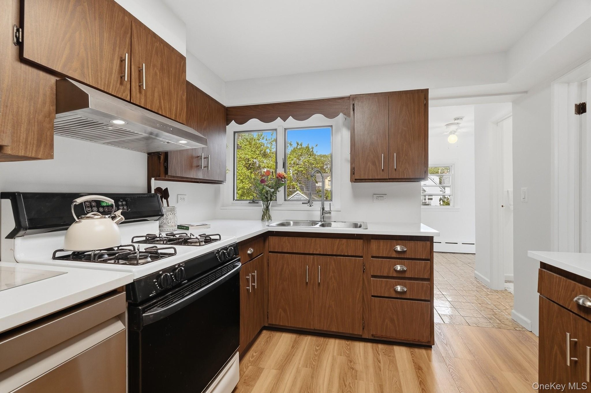 Bright modern Kitchen with picture window looking out into the backyard