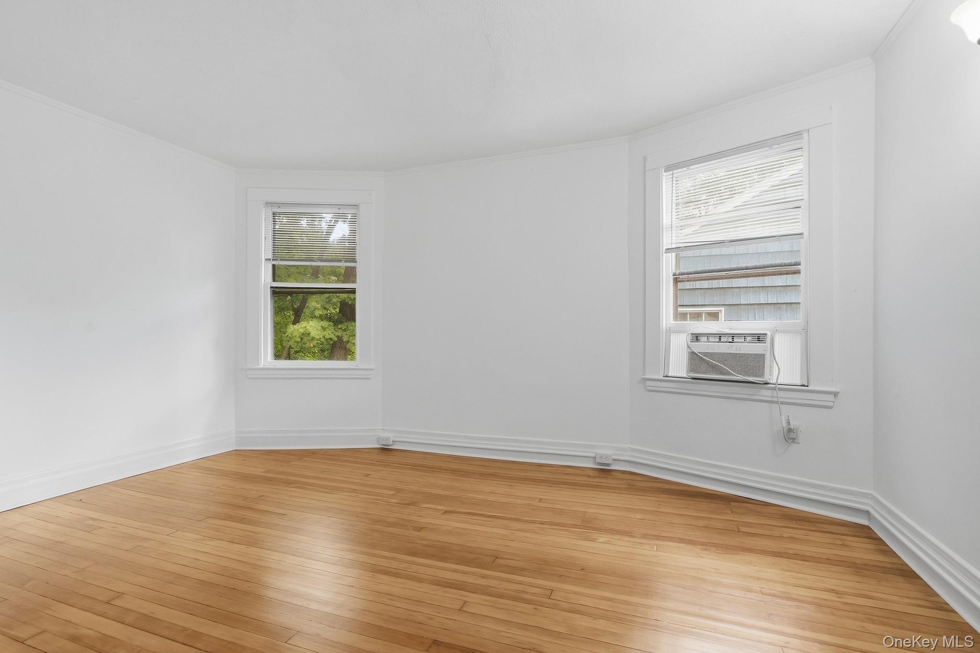 Bedroom with refinished wood floors