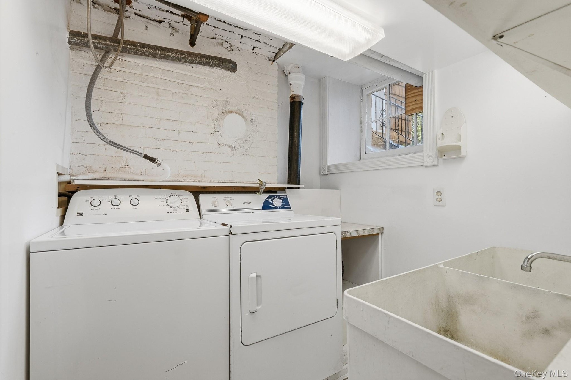 Full-size washer and dryer and slop sink