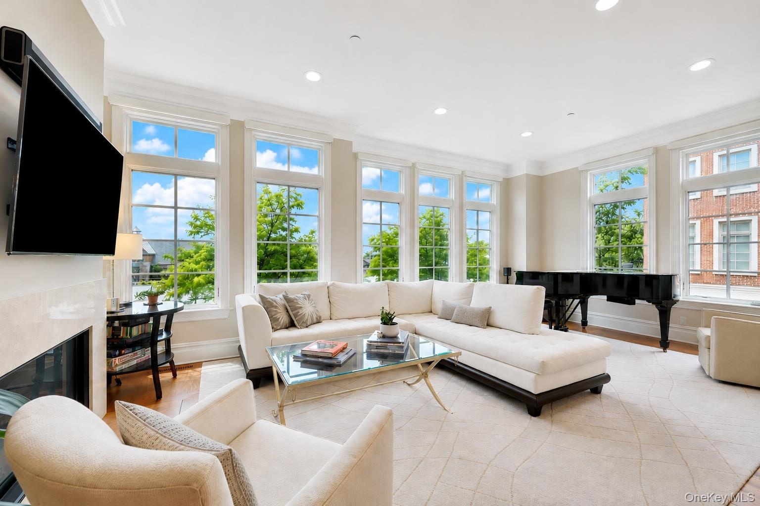 Sprawling and sunny, complete with fireplace and oversized windows that allow for river views