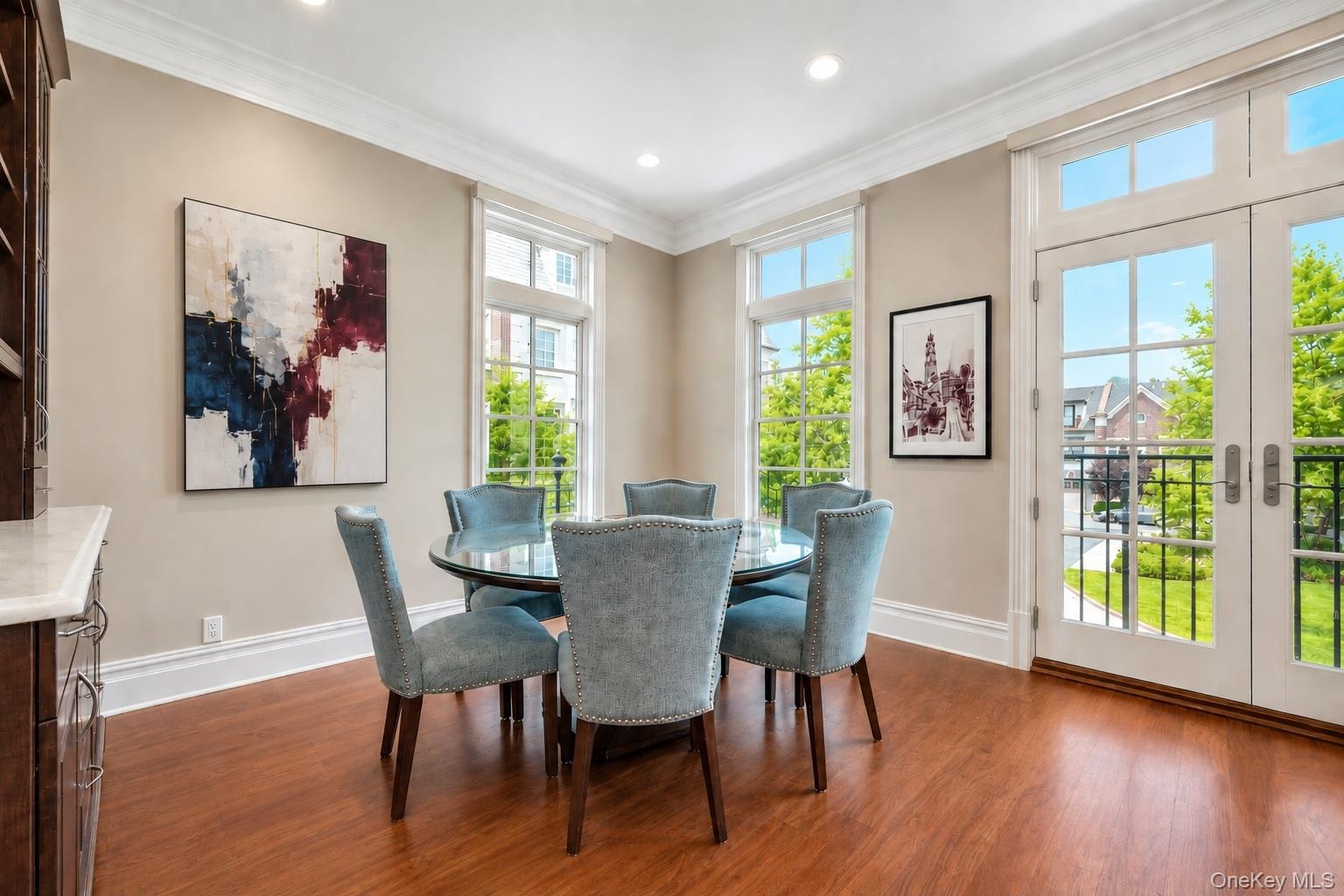 Enjoys oversized windows, Juliet balcony with built in custom cabinetry