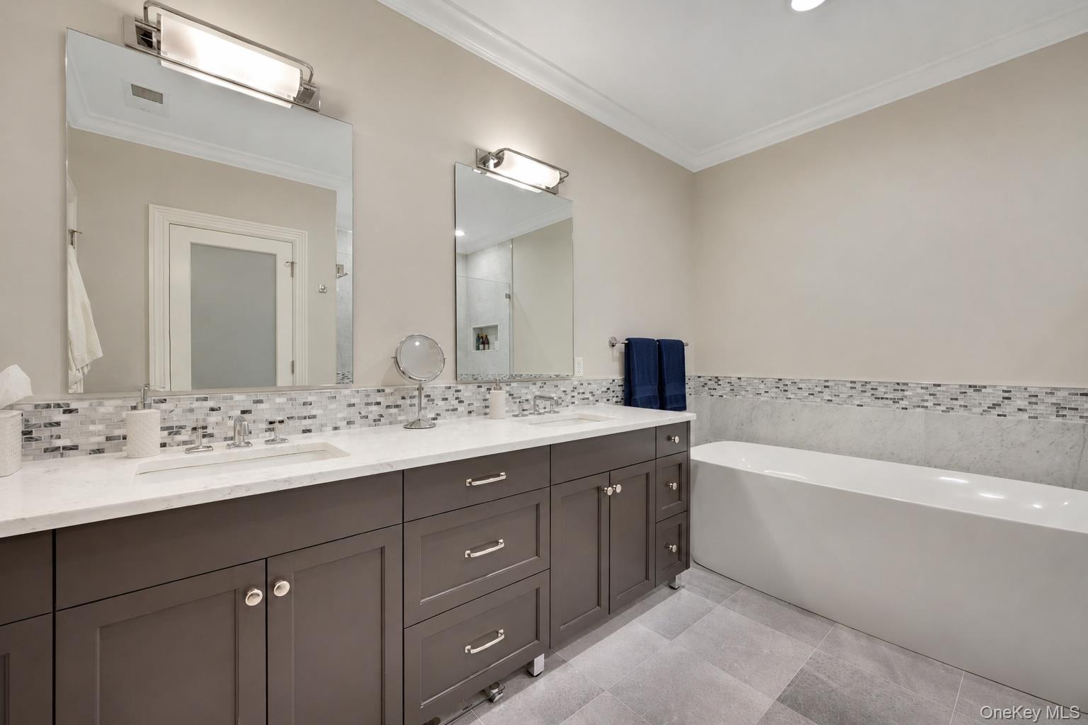 Double marble vanity, Waterworks fixtures and standalone soaking tub