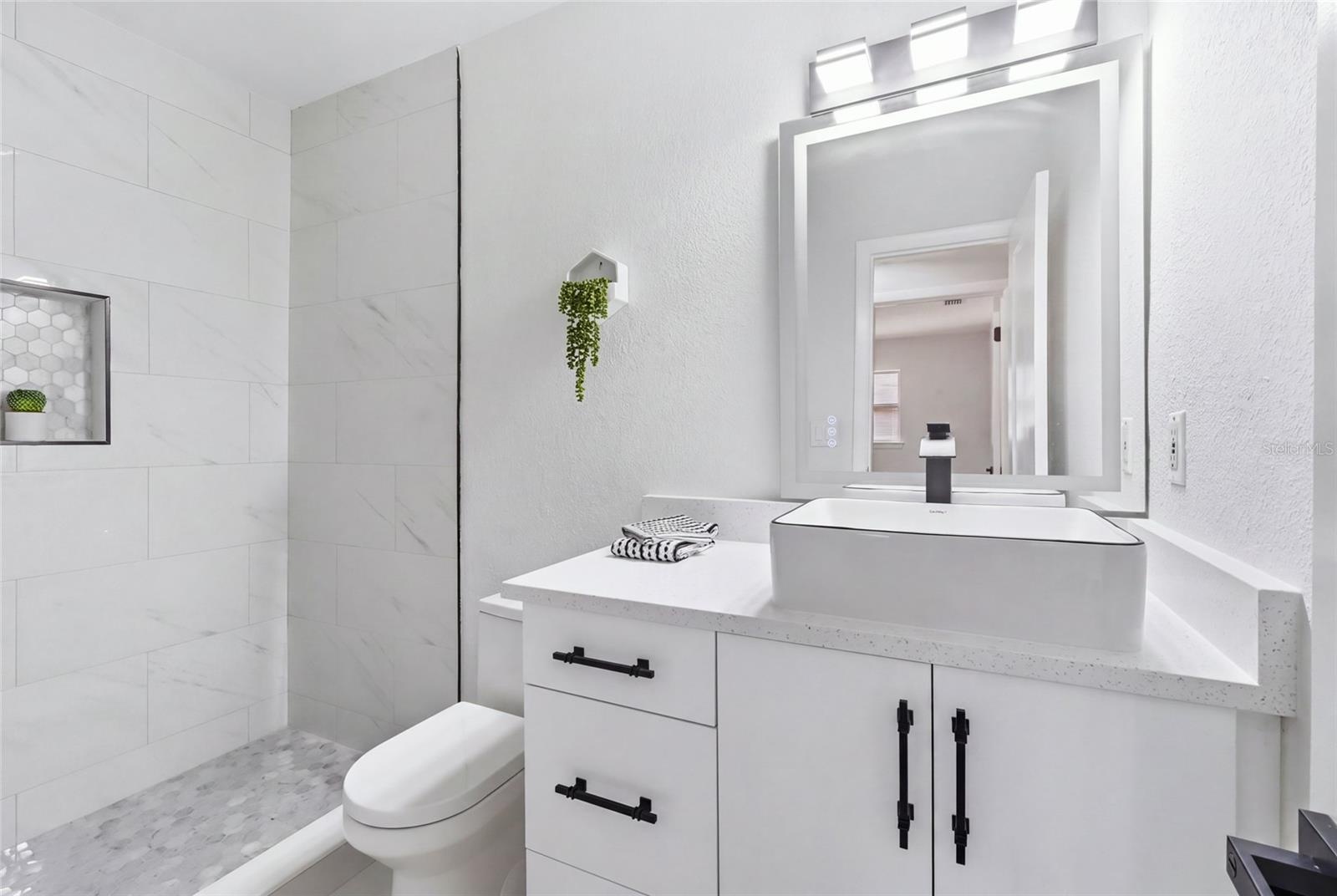 2nd Bathroom features a Walk-In Shower (no tub).