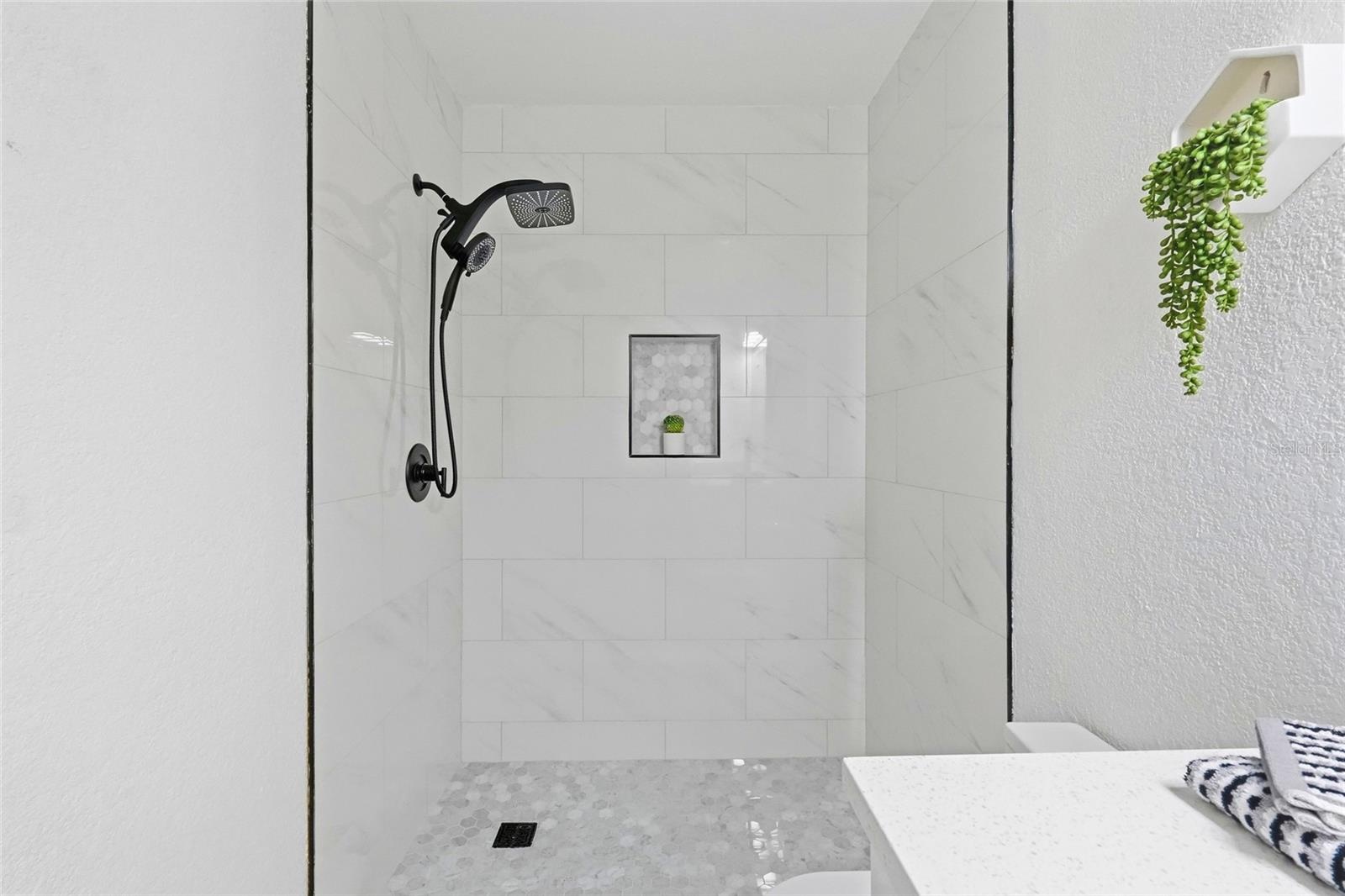 2nd Bathroom features a Walk-In Shower (no tub).