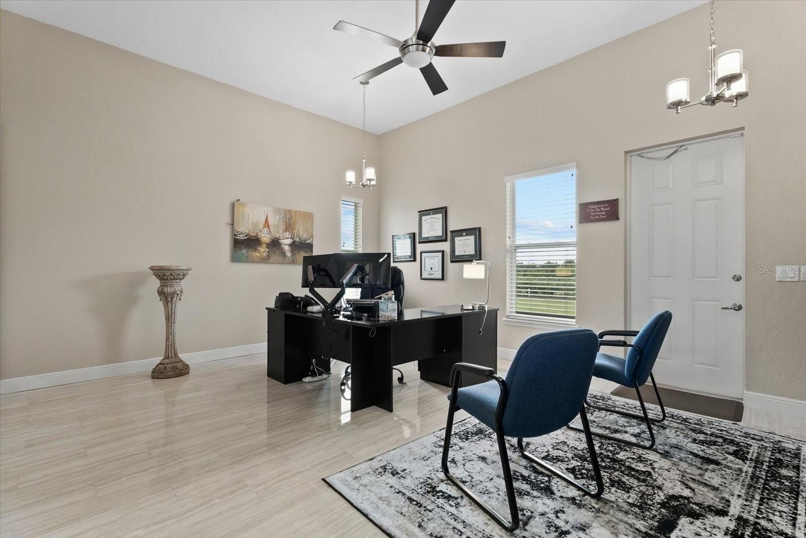 The inlaw suite is currently used as an office.  This room could be the living/dining room, if the conference room is staged as a bedroom