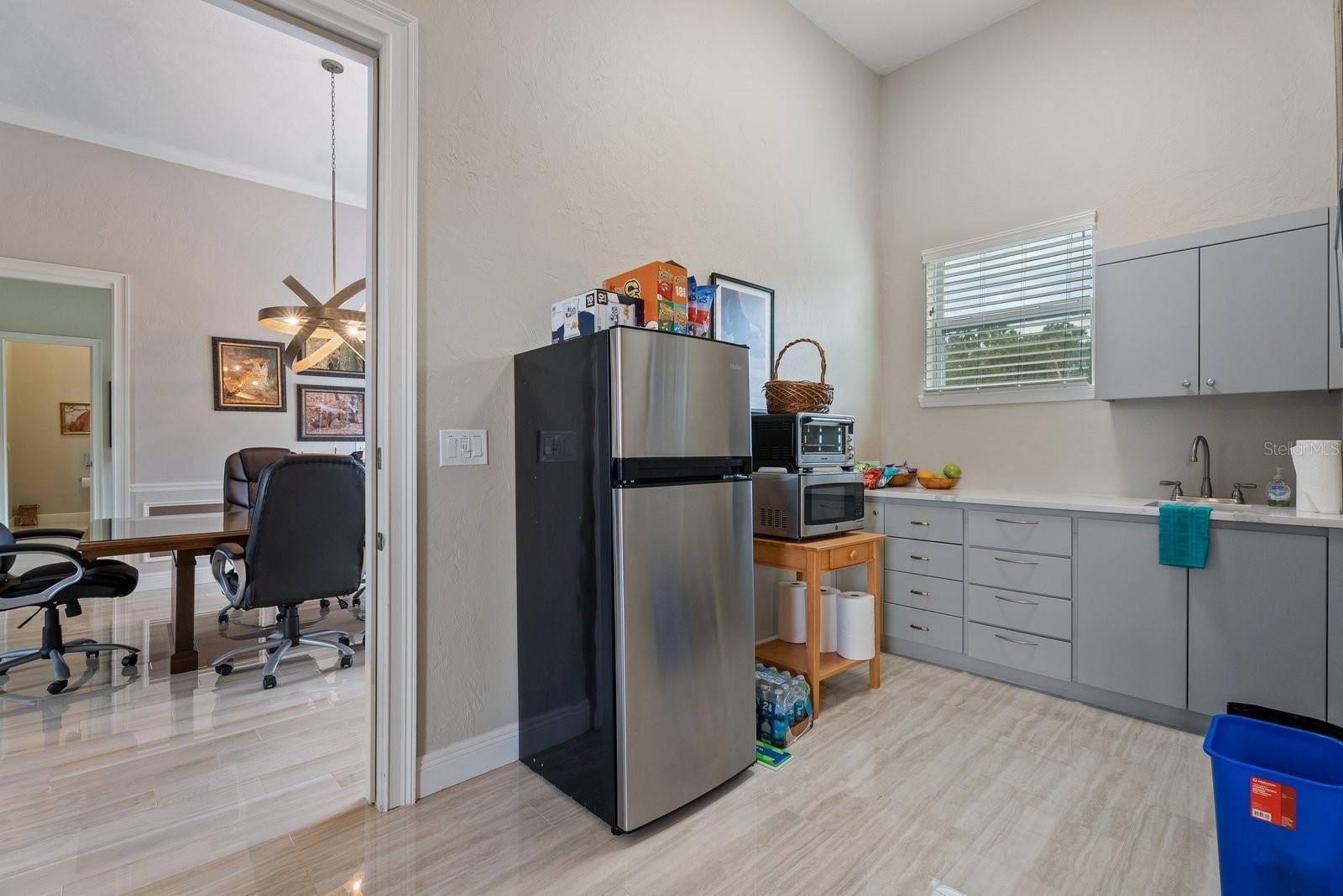 Kitchenette in the inlaw suite, showing the access door to the flex space conference room and door into the media room. Either door can be locked off 