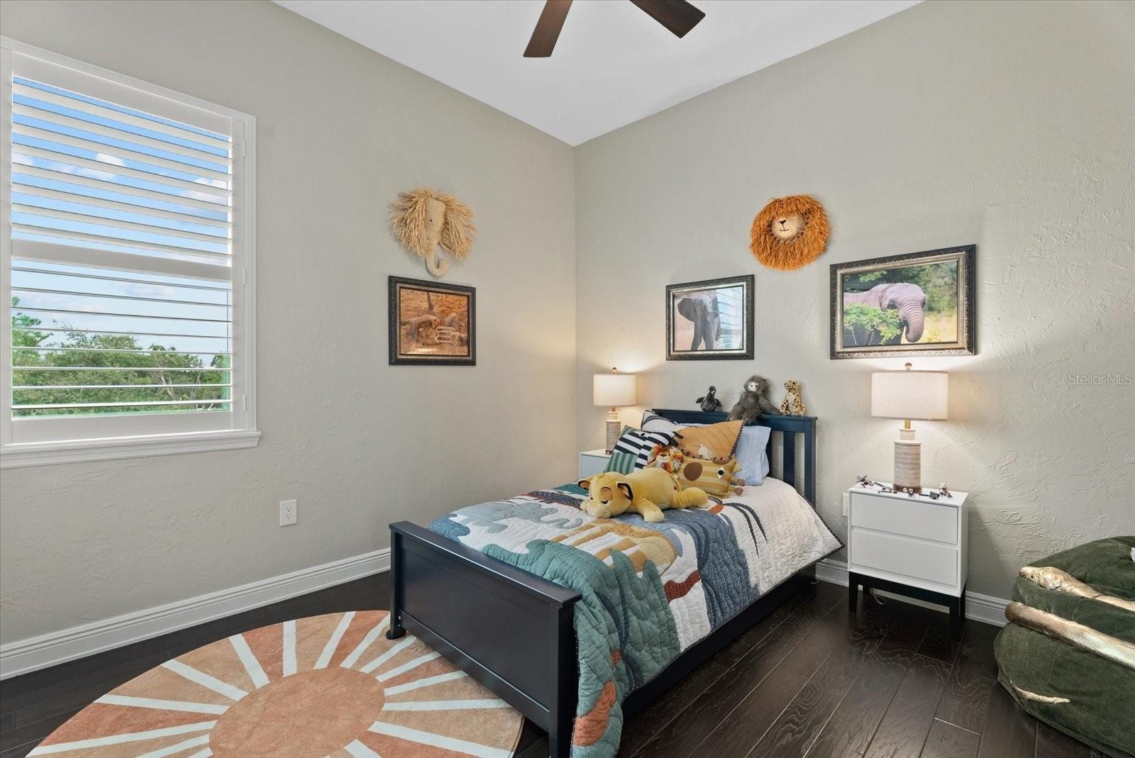 Bedroom four is a cosy space, with hardwood floors, built-in closet and access to the Jack and Jill bathroom
