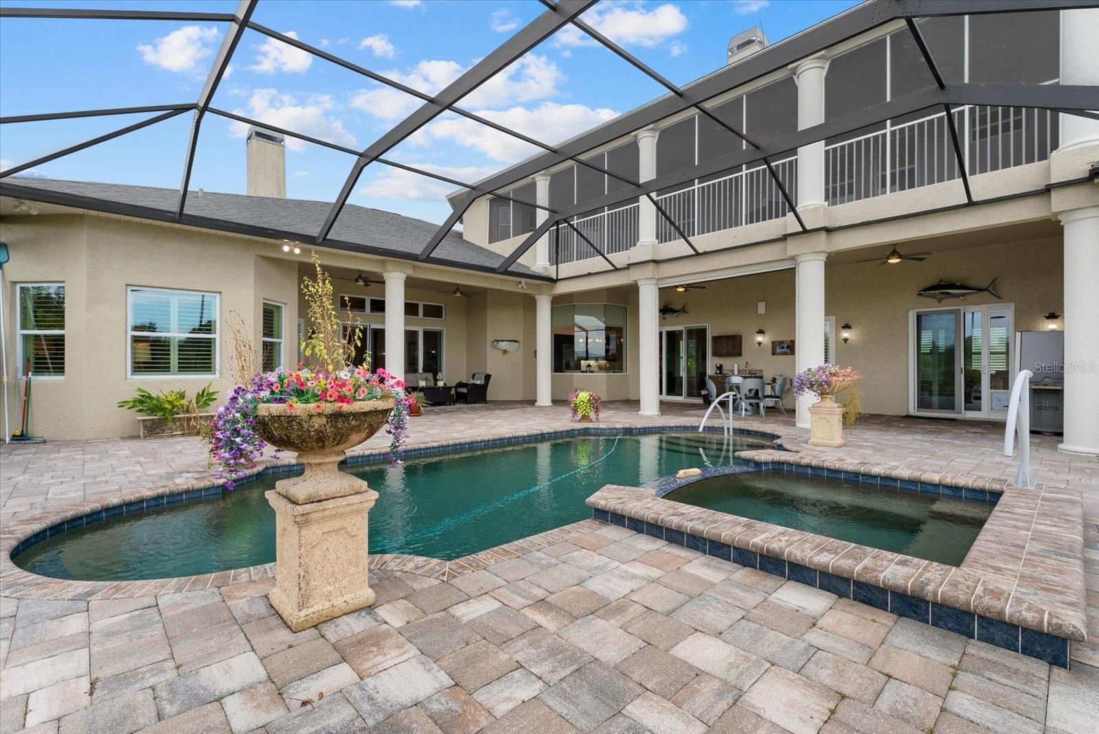Enjoy the heated spa that spills over into the pool