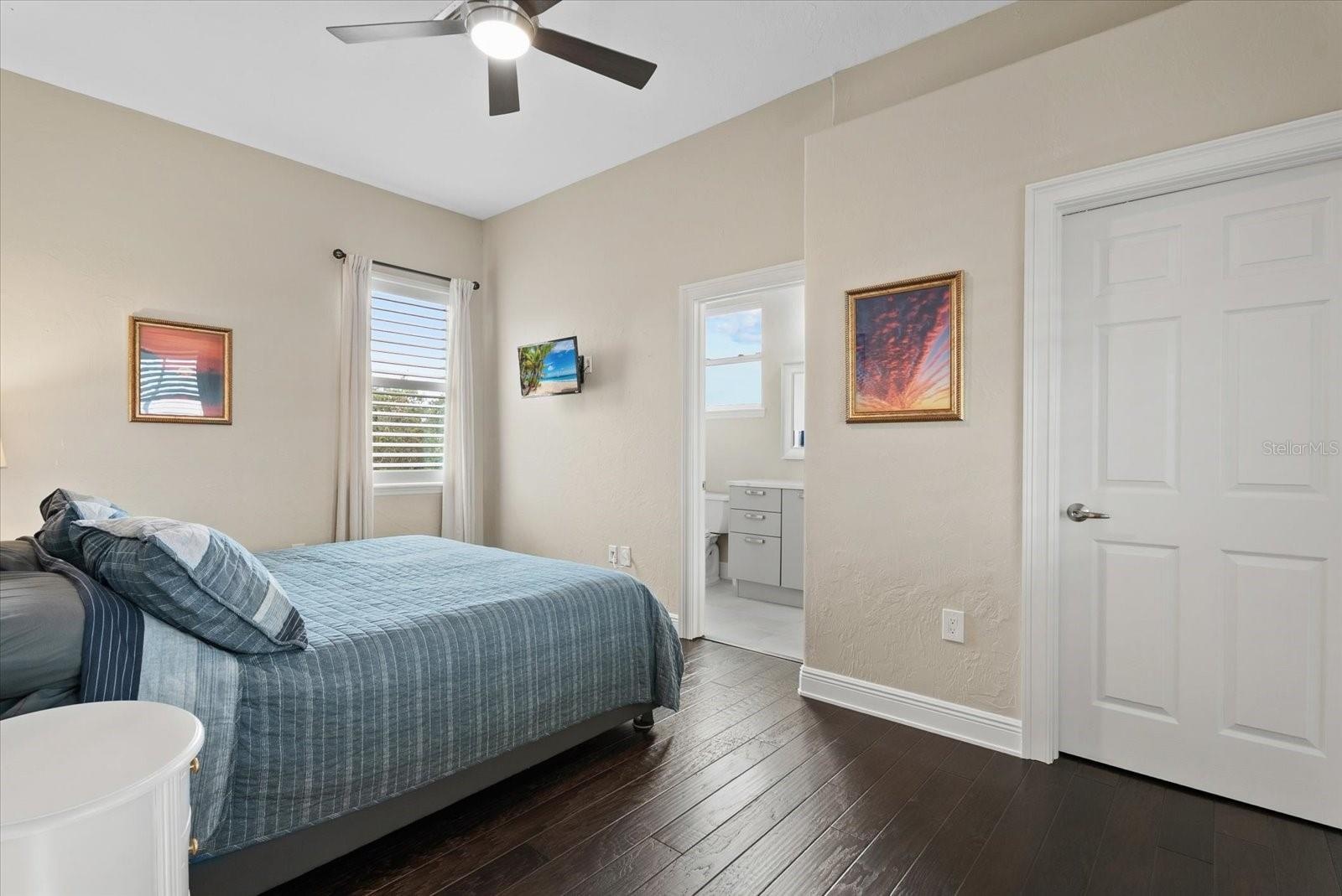 Bedroom five is also upstairs, with a walk-in closet and private ensuite bath