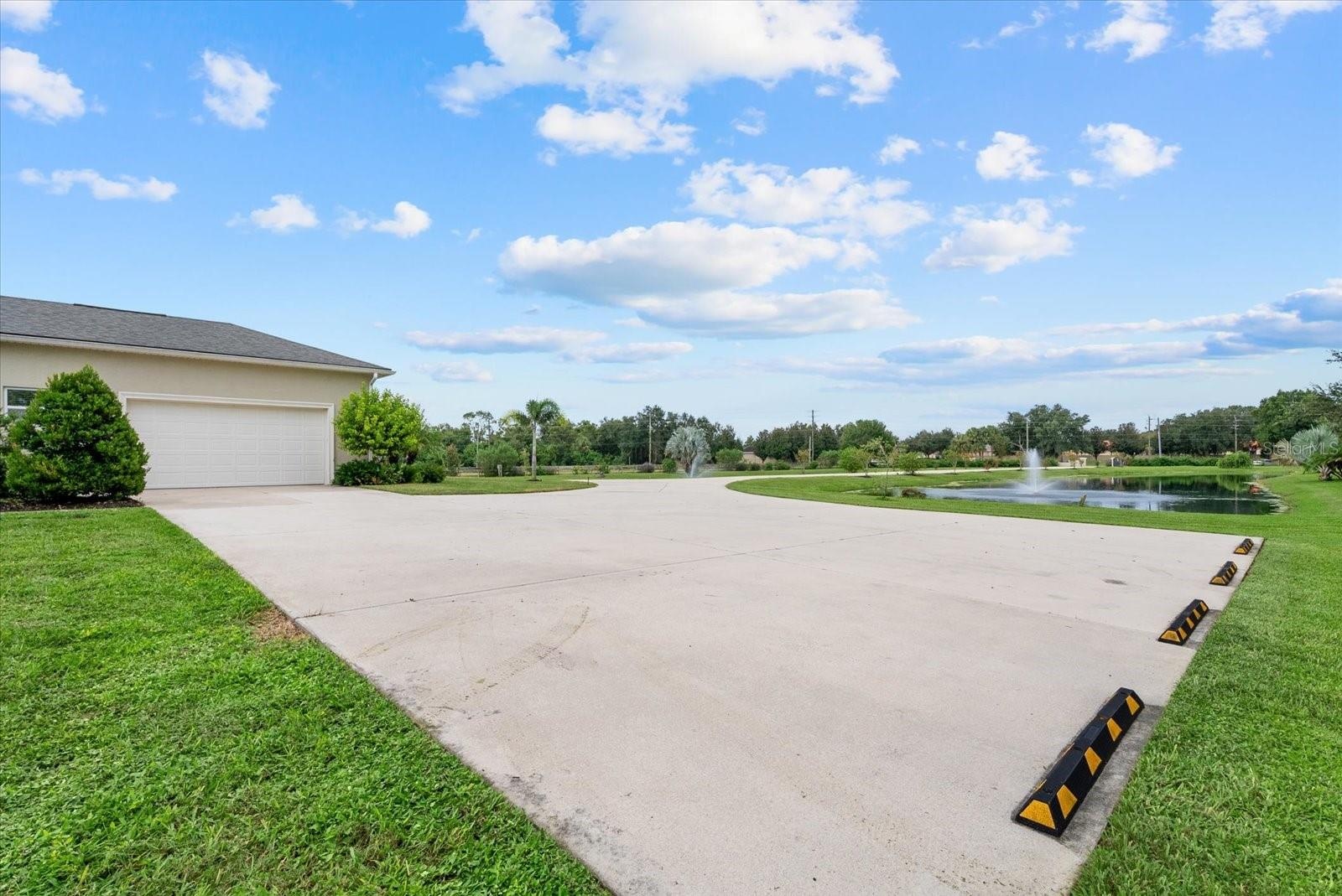 The extended parking pad on the south side of the home